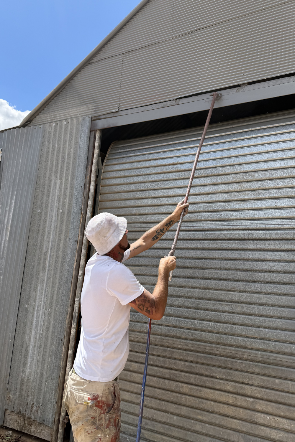 Alfie Hendry of Hendry’s Restorations. painting a shed in Eurombah.
