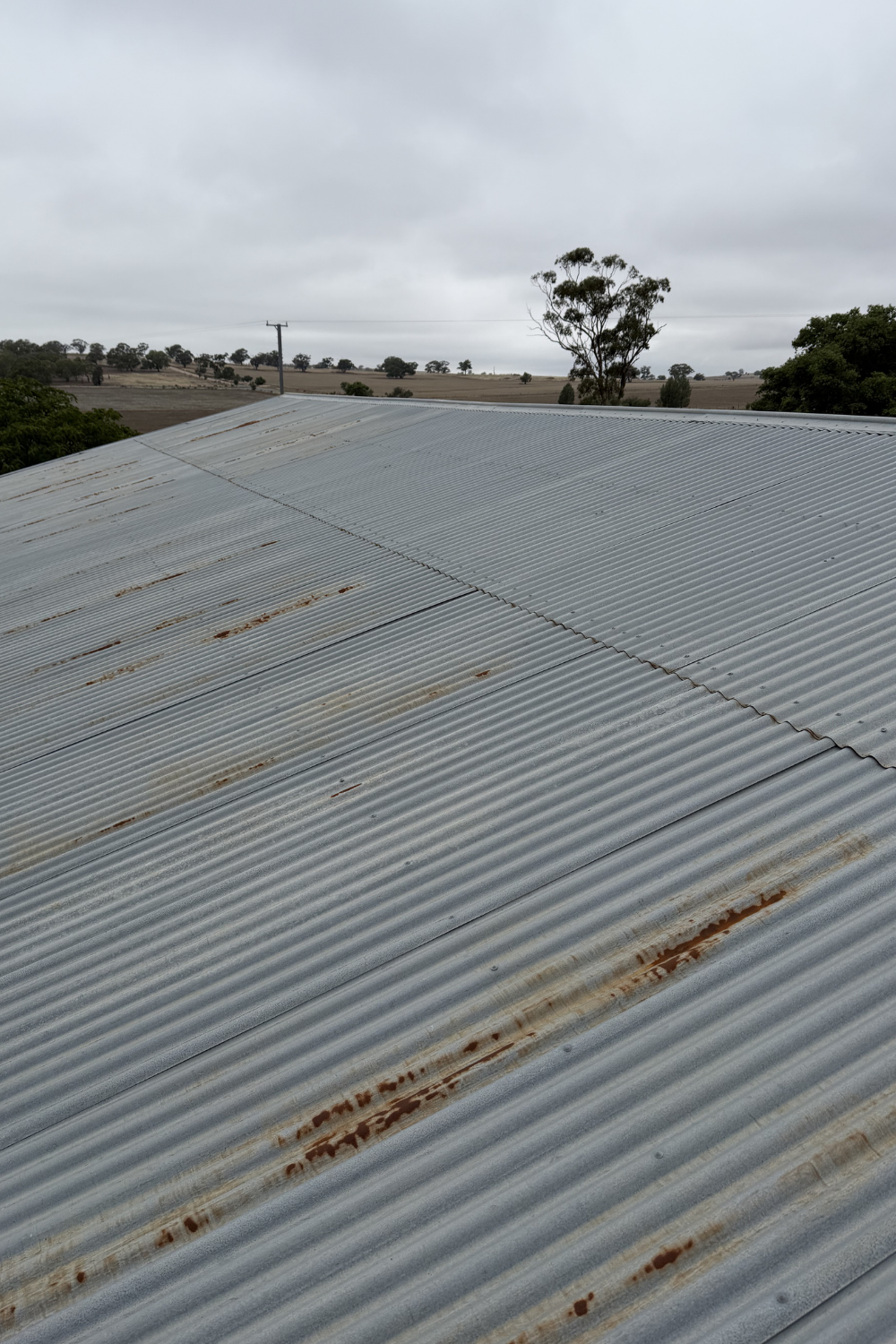 A rusty metal roof in Valentines Plains prior to painting.