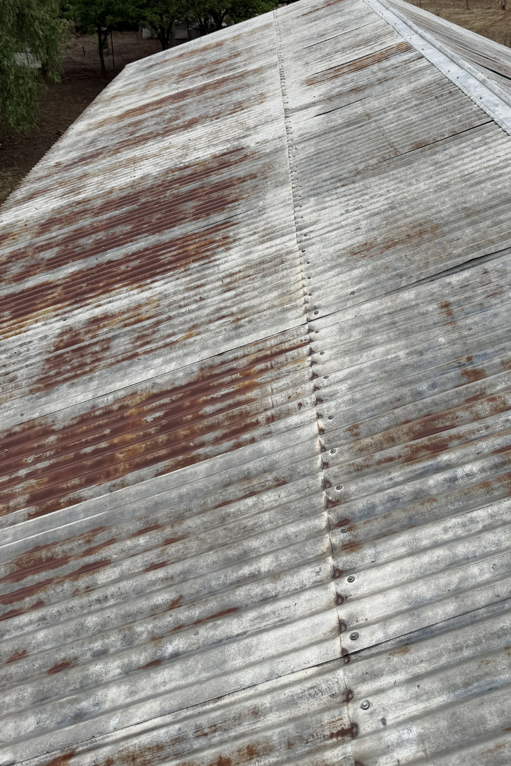 A rusty metal roof prior to painting in Duaringa.