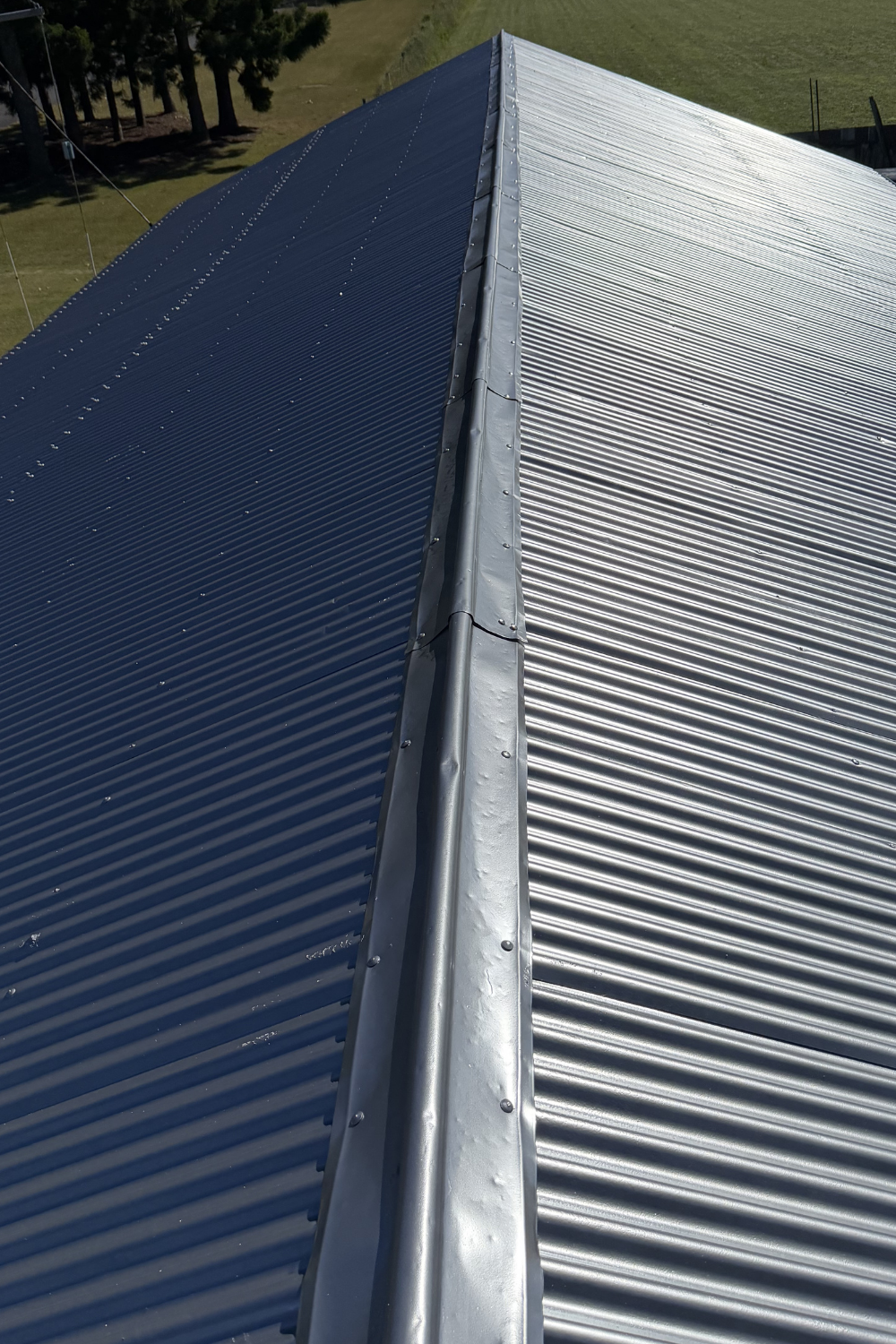 A silver roof in Rolleston which has been freshly painted silver.