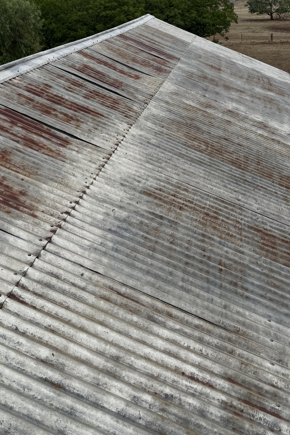 A rusty metal roof in Theodore prior to painting.