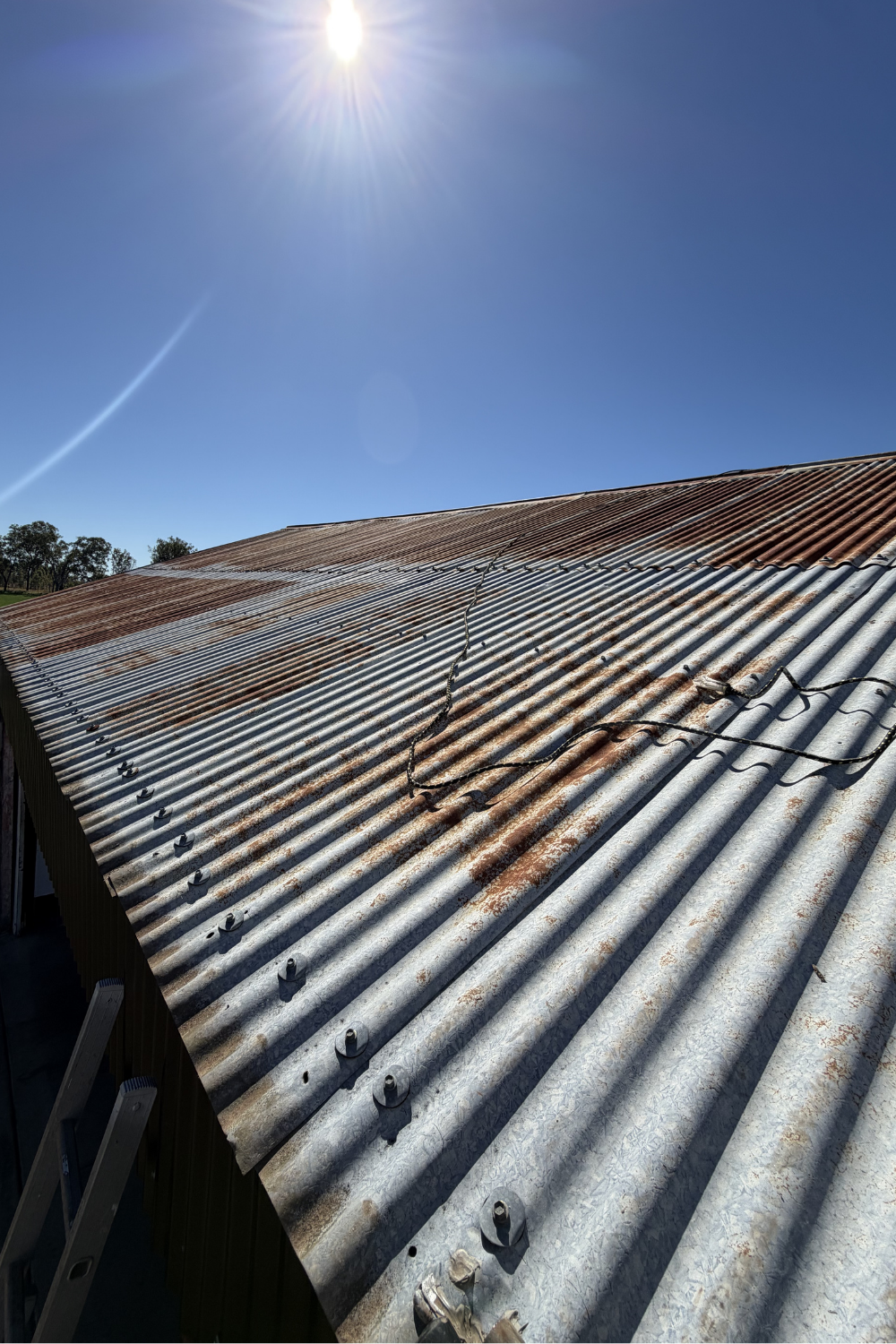 A rusty metal roof in Moura prior to painting.