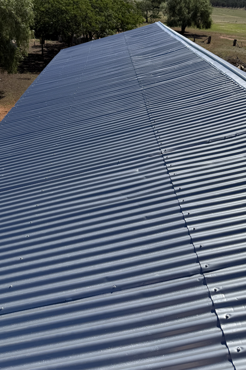A freshly painted metal roof in Banana after painting grey.