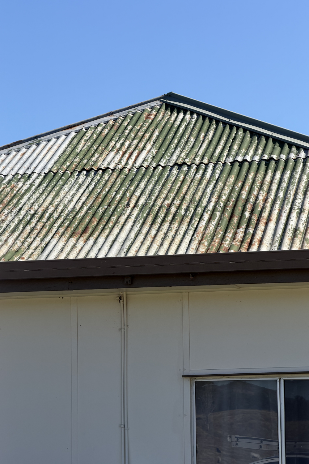 A rusty metal roof in Blackwater prior to painting.