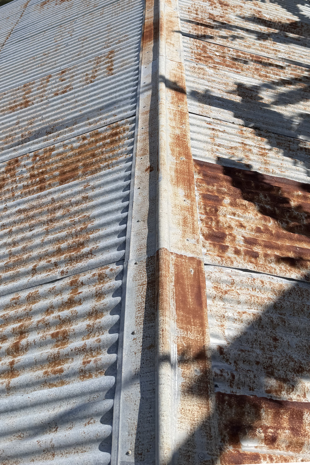A rusty metal roof in Wallumbilla prior to painting.