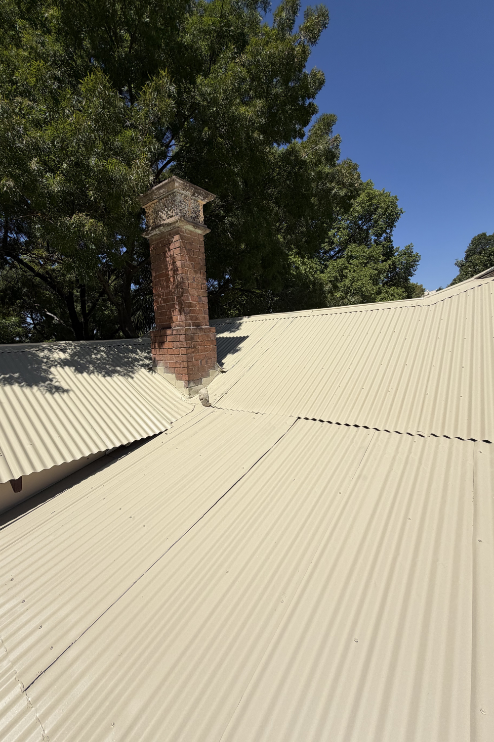 A freshly painted metal roof in Eurombah after painting cream.