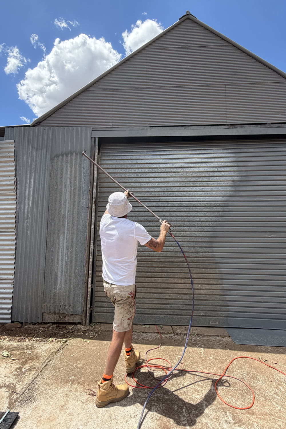 Alfie Hendry of Hendry’s Restorations painting a shed in Dixalea.
