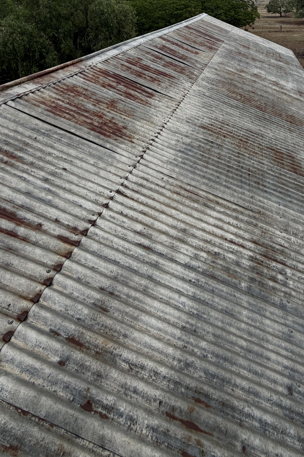 An old, rusty, damaged metal roof in Dingo, Queensland.