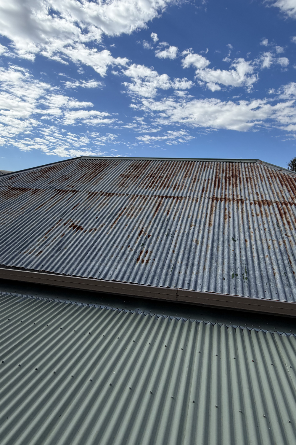 An old, rusty metal roof in Willows, Queensland, which was badly needing painted.