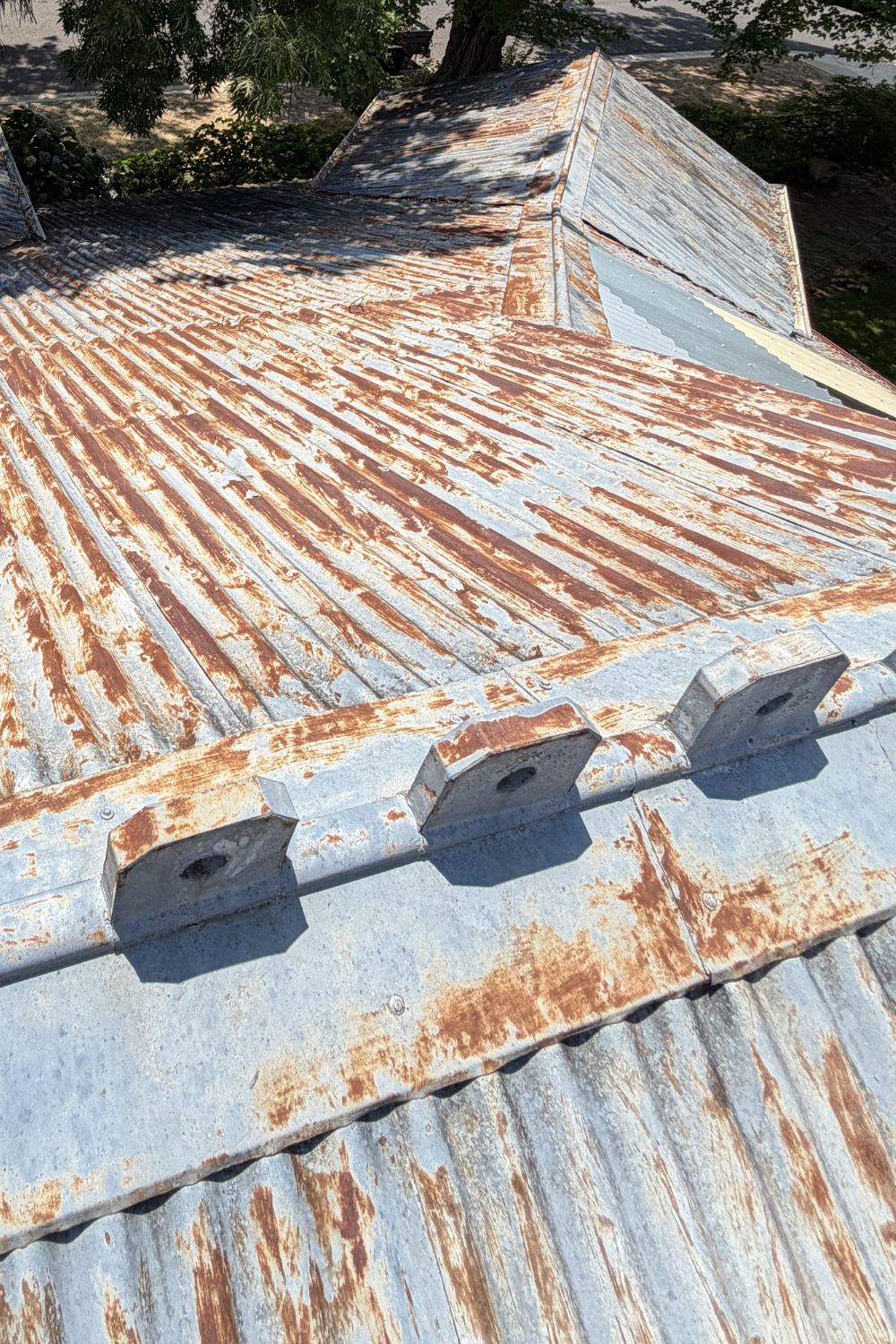 A rusty metal roof in Lawgi Dawes prior to painting.