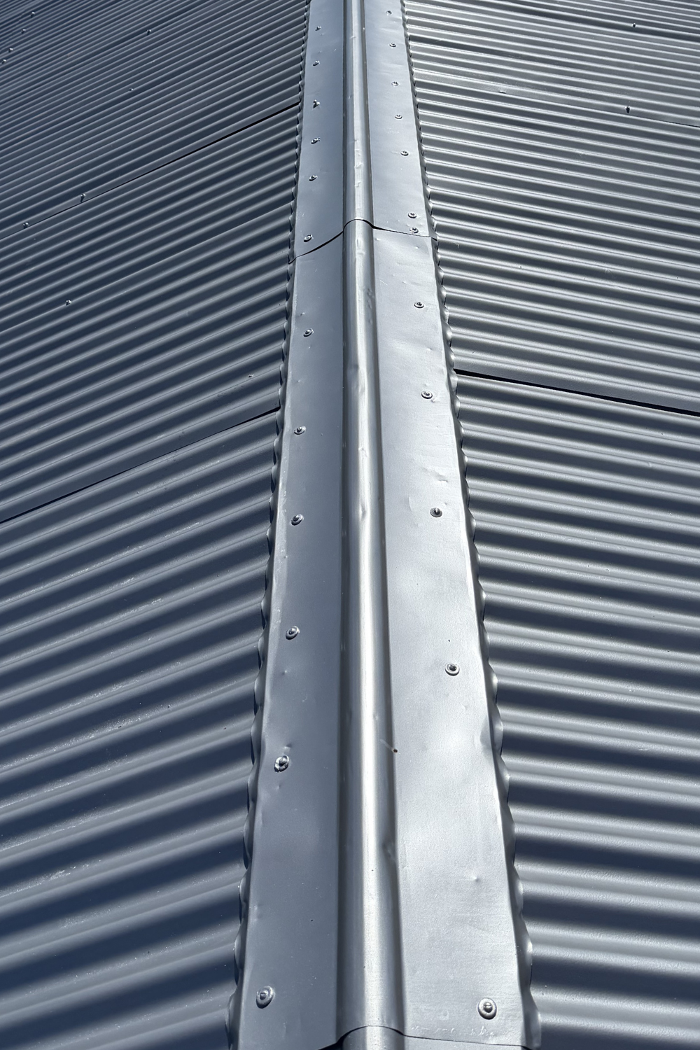 A roof after painting with a heat-reflective, rustproof coating.