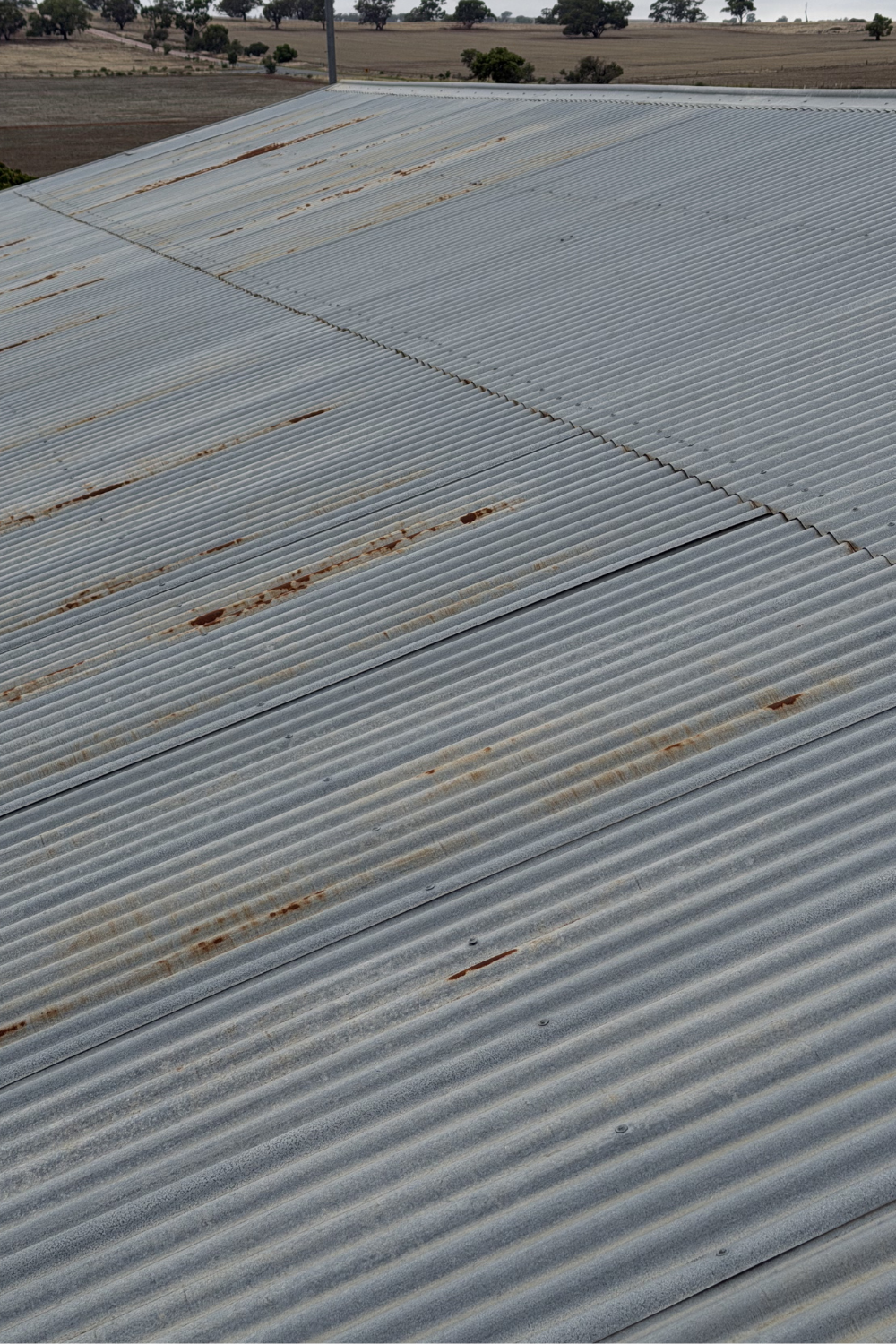 A rusty metal roof in Goovigen prior to painting.