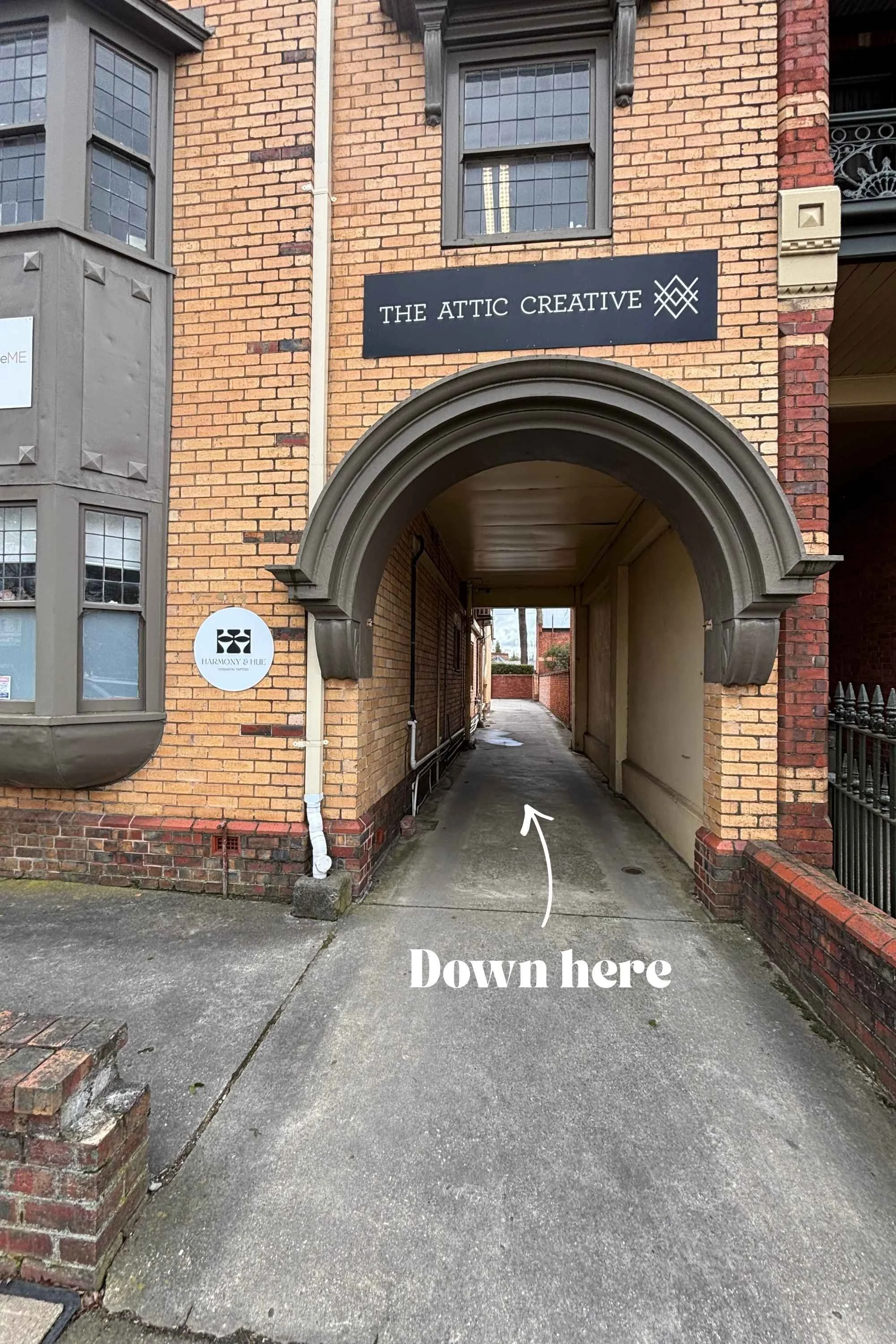 Image shows the front of 712 Sturt Street, Ballarat central. The building's sign reads 'The Attic Creative". Also on the frontage is the business sign for Harmony and Hue Cosmetic Tattoo.