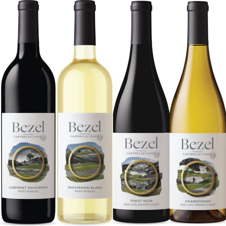 Four bottles of wine, from left to right: Cabernet Sauvignon, Sauvignon Blanc, Pinot Noir, and Chardonnay, with labels showing vineyards and the Bezel brand.