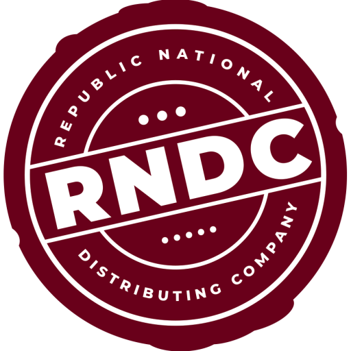 Black and white circular logo for the Republican National Distributing Company with the acronym "RNDC" in large bold letters in the center.