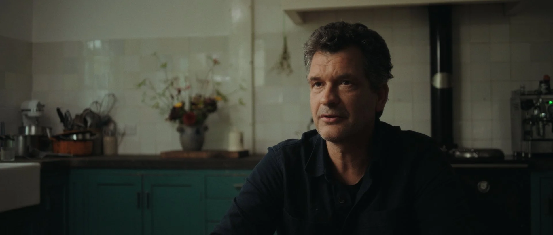 A similar angle from the same kitchen interview, subtle shadows adding depth and richness