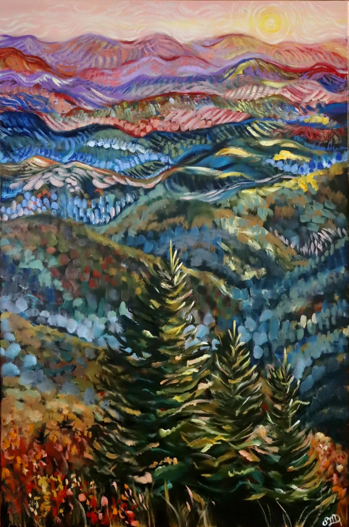 Impressionist-style landscape painting of rolling hills and mountains with vibrant colors, including greens, blues, reds, purples, and pinks, under a bright sun in the sky. Foreground features trees and foliage.