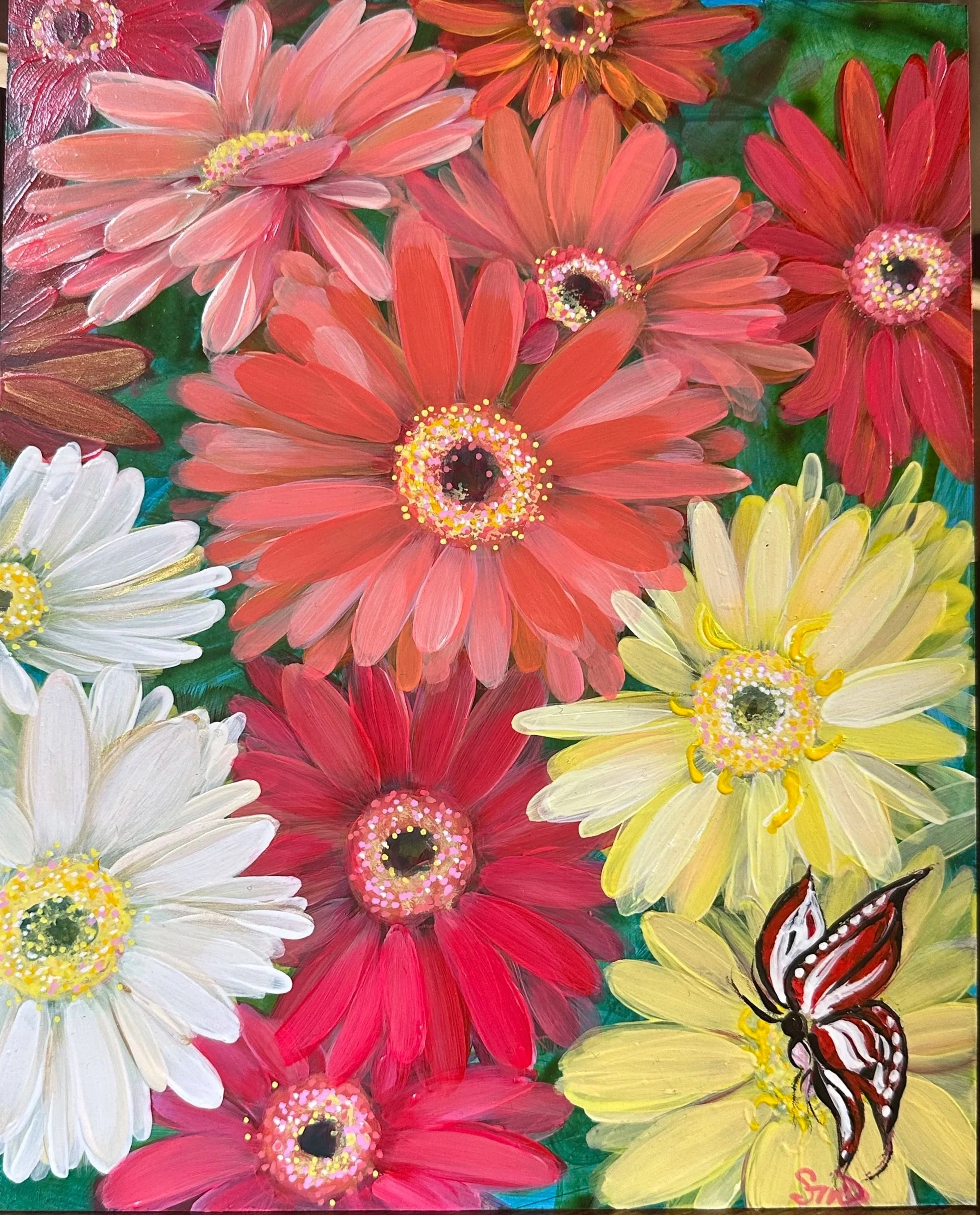 Bright, colorful painting of various large daisy-like flowers in shades of pink, red, white, and yellow with a green background. Includes two prominent butterflies, one at the bottom right corner and another at the bottom center, both with red, black
