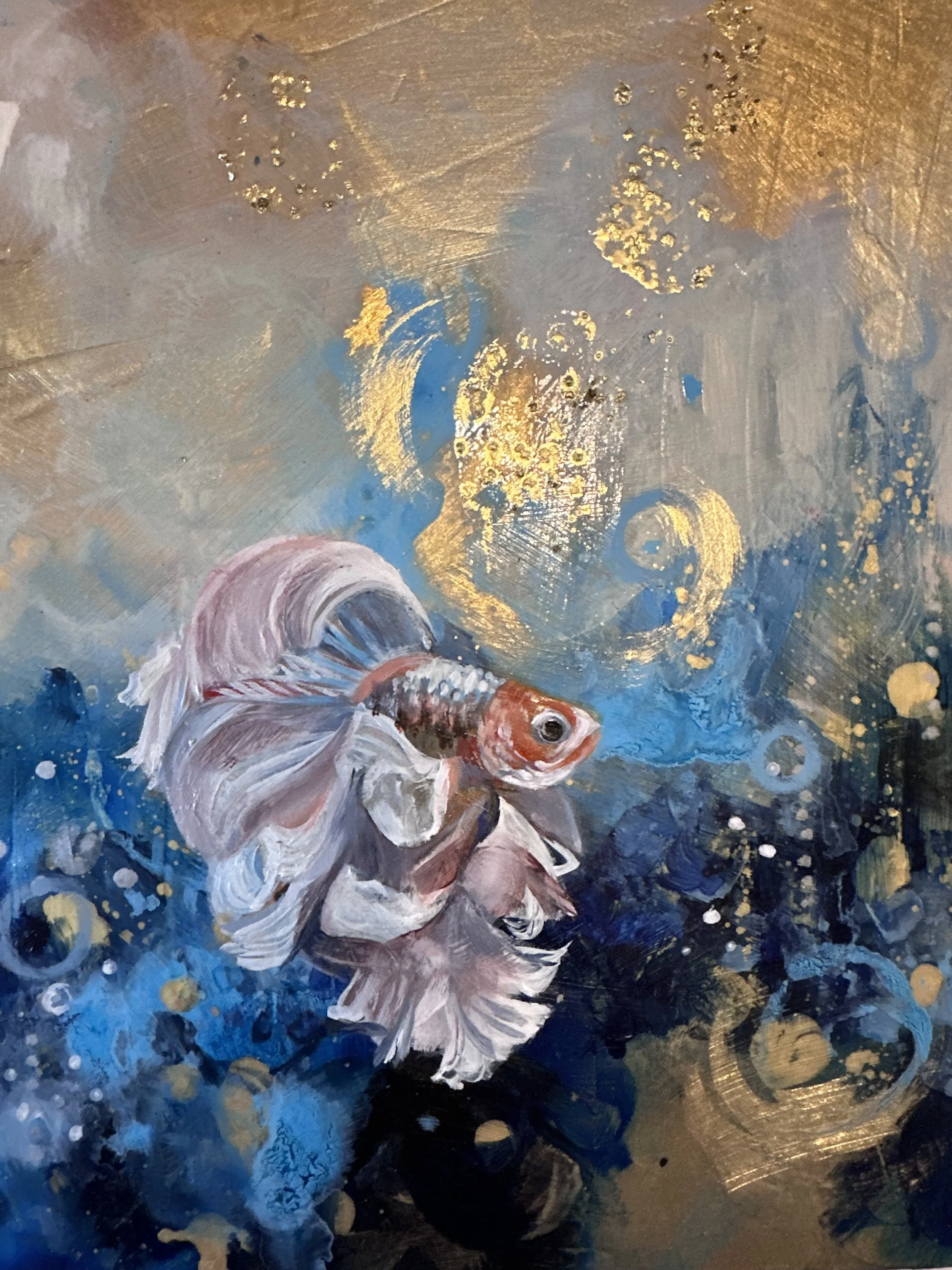 A painting of a goldfish in water with gold and white accents and swirling patterns.