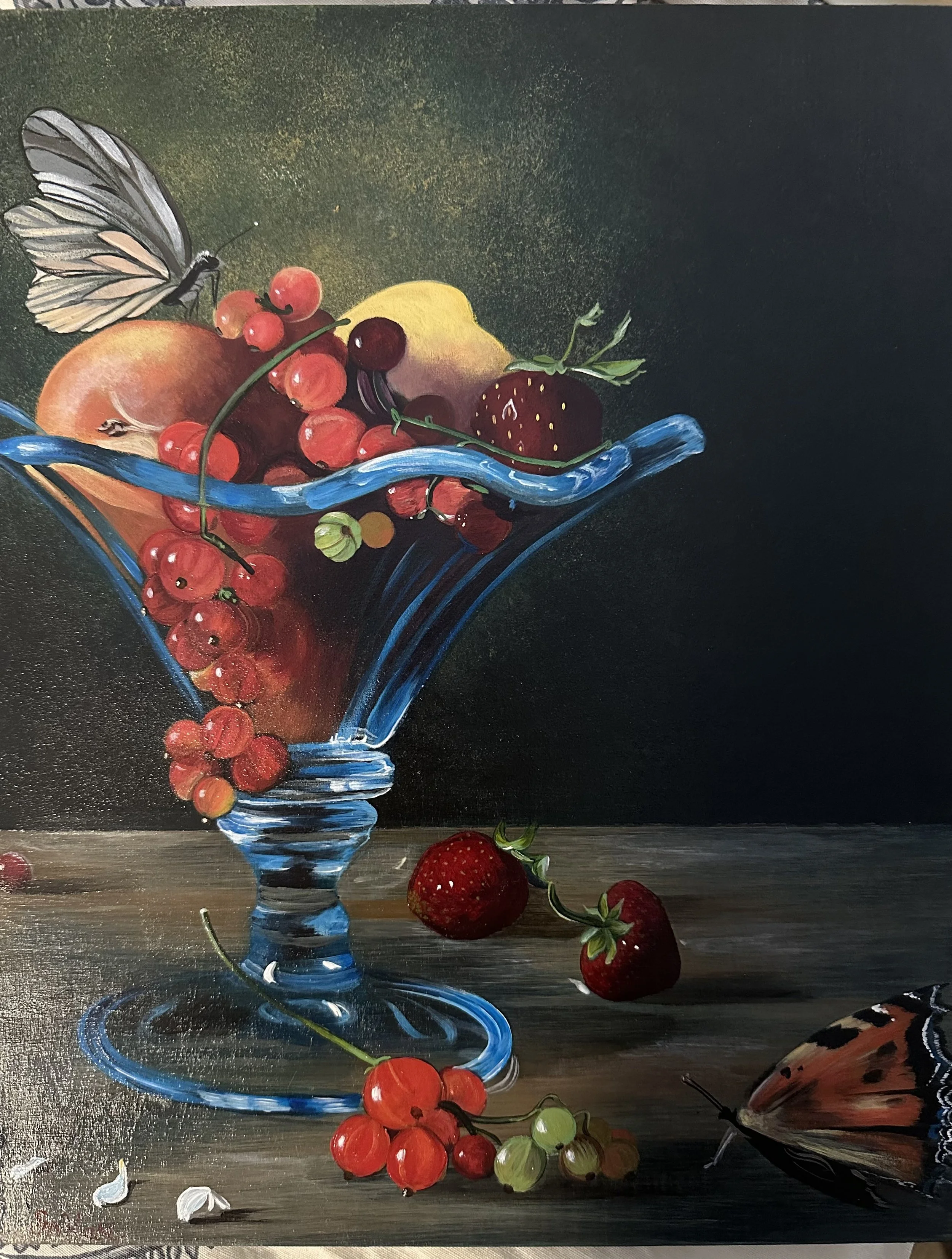 A still life painting of a blue glass vase filled with a variety of berries, including strawberries, red currants, black currants, and gooseberries, with a butterfly perched on the berries and a dark background.