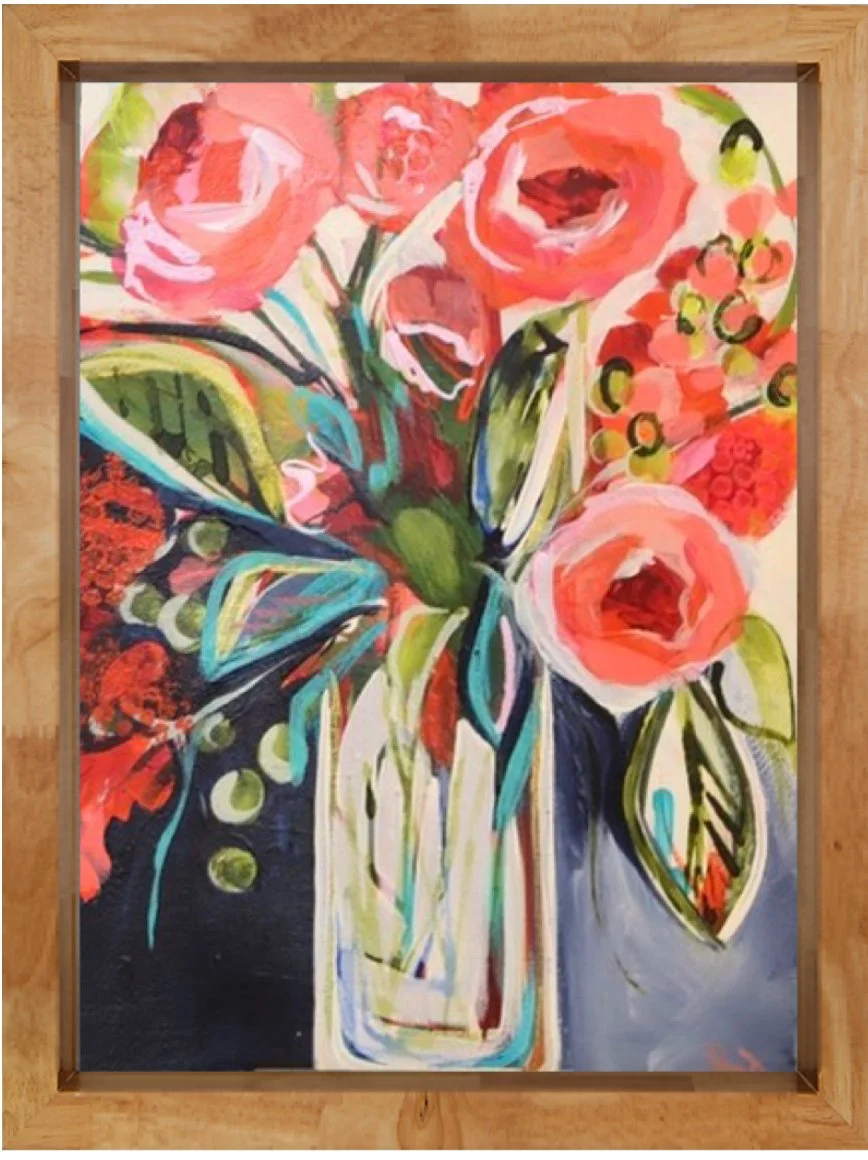 Bright, colorful abstract painting of a bouquet of flowers in a glass vase, featuring large pink and red roses, green leaves, and various foliage on a dark background, framed in wood.
