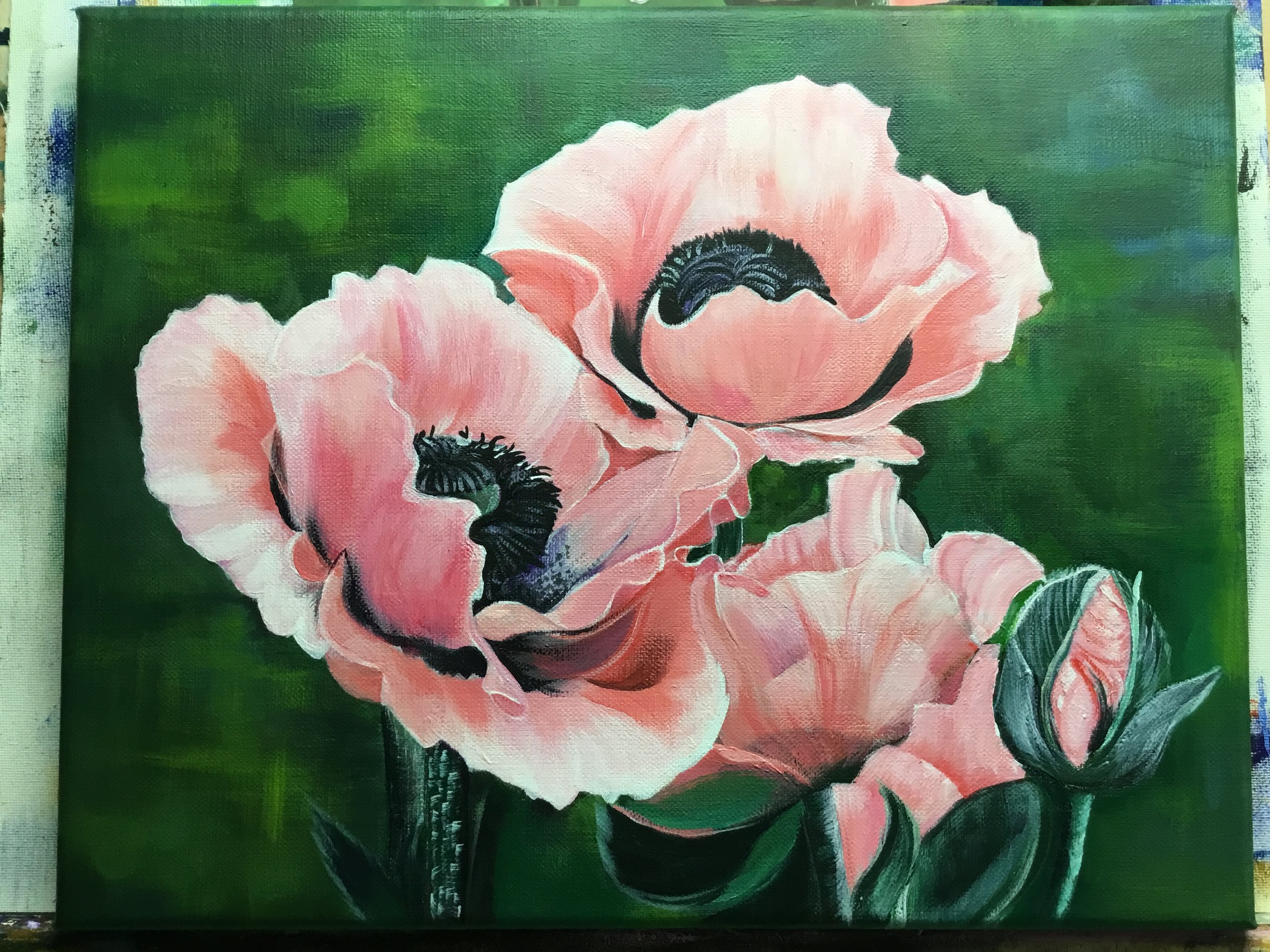 A painting of pink poppies with black centers on a green background.