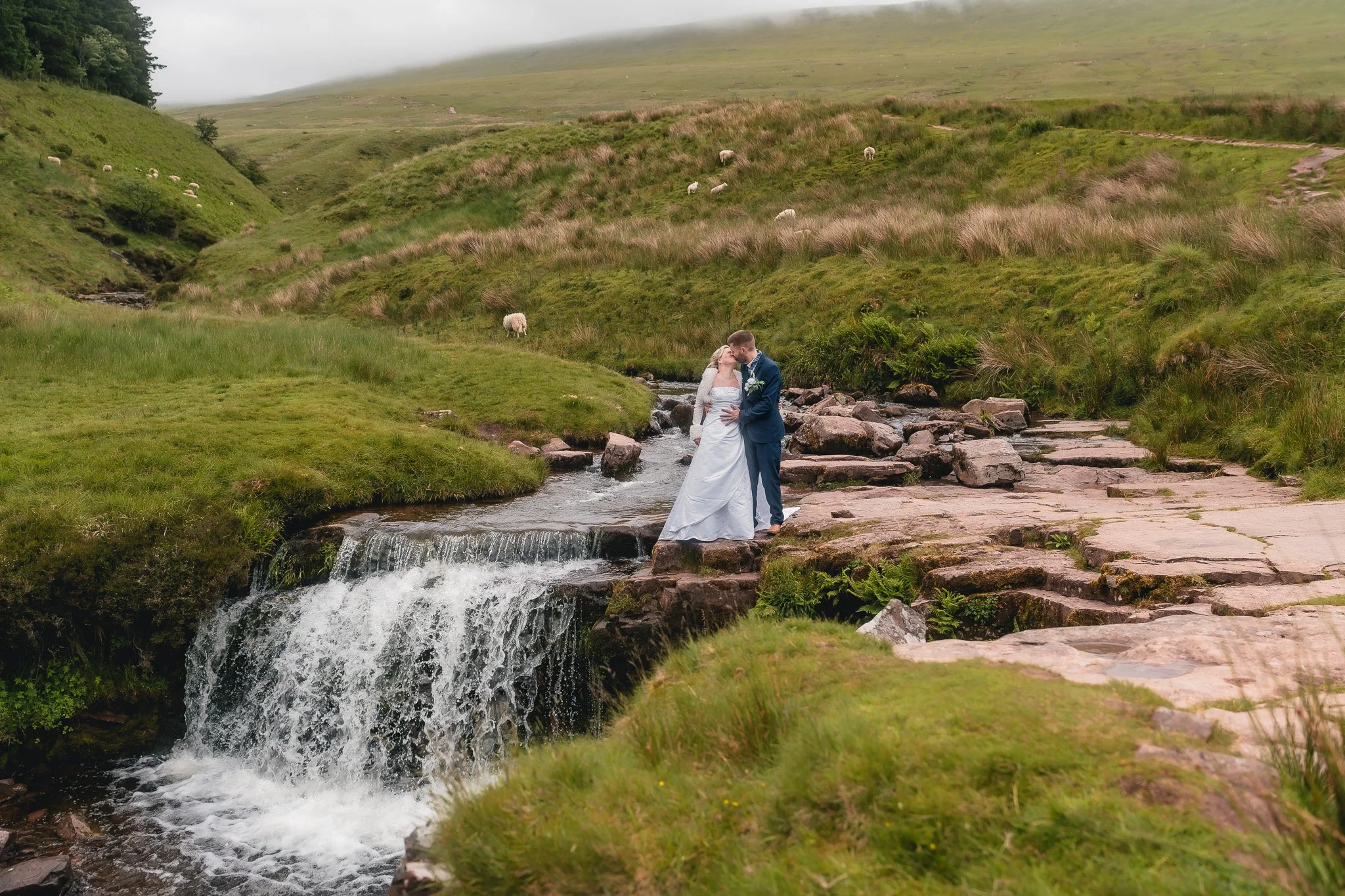 Relaxed wedding portraits by a Welsh waterfall