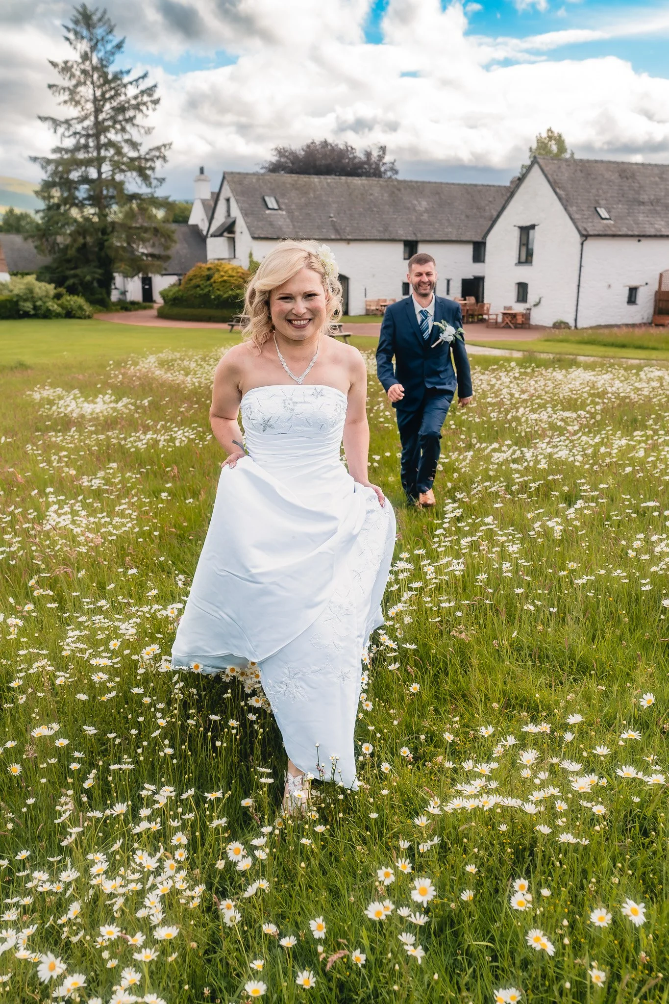Bride and groom walking together at Barn at Brynich