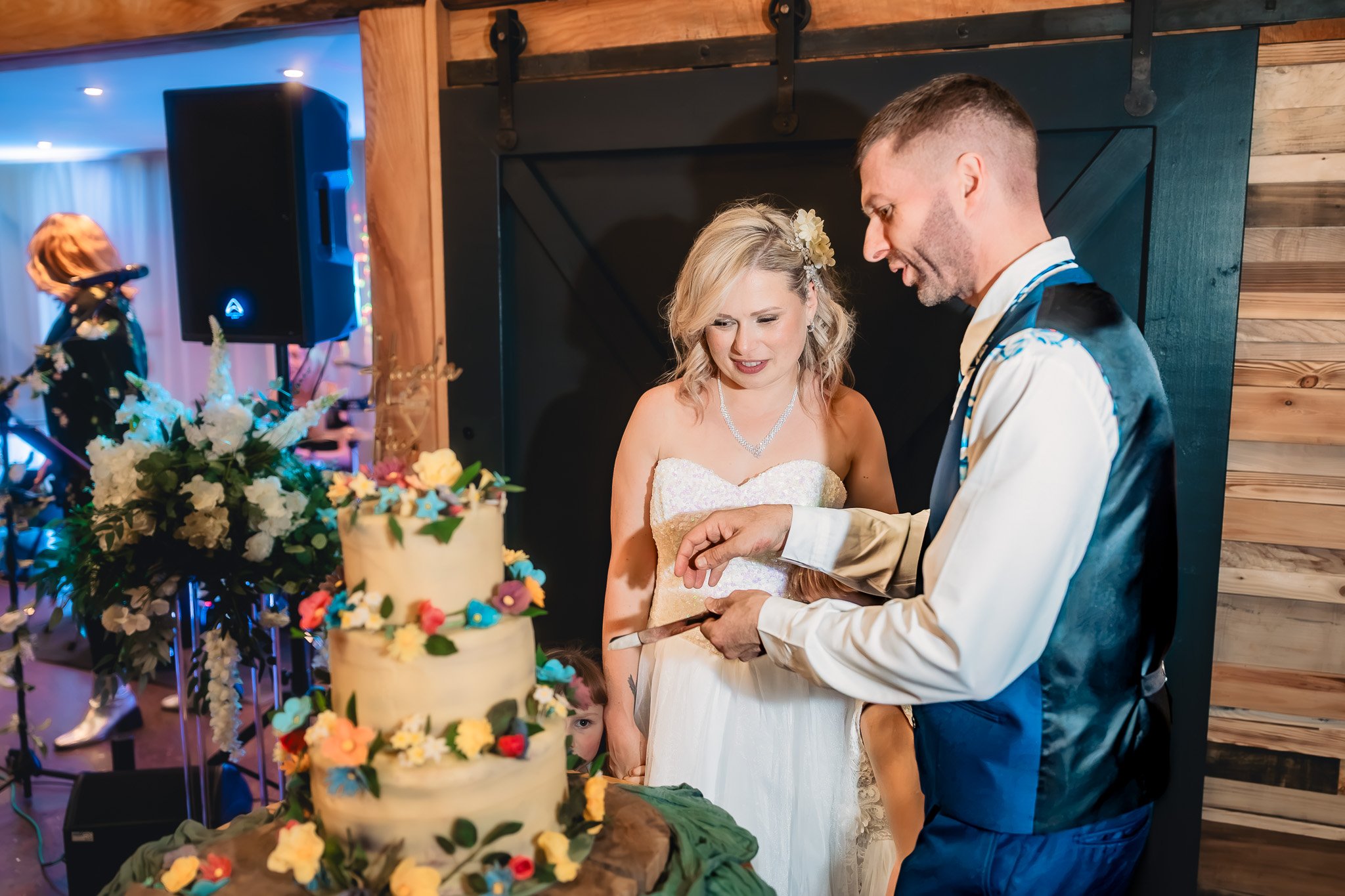 Bride and groom cutting their wedding cake