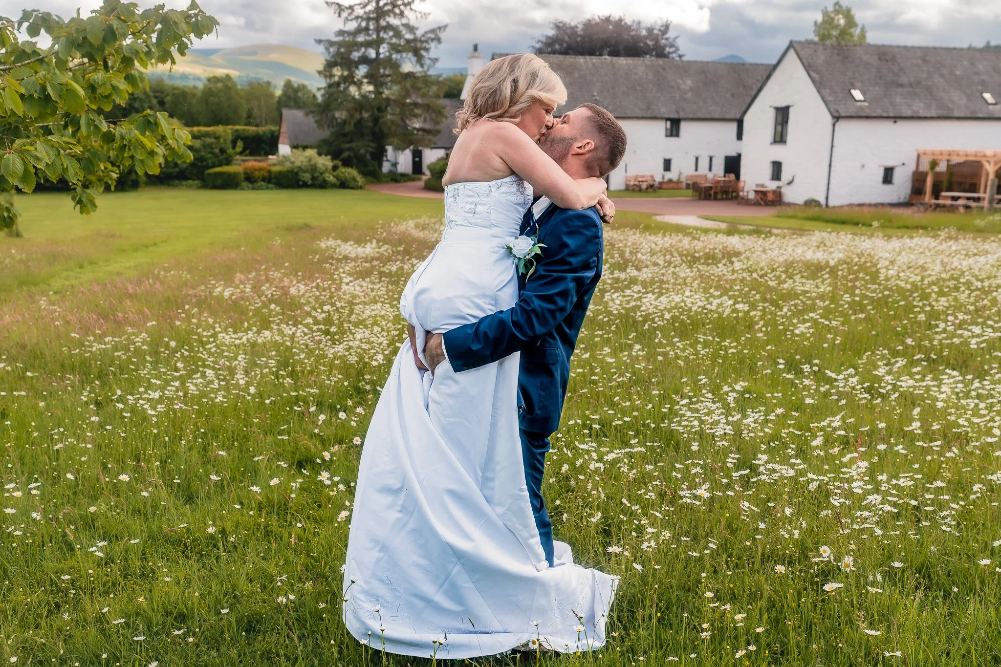 Bride and groom walking together at Barn at Brynich