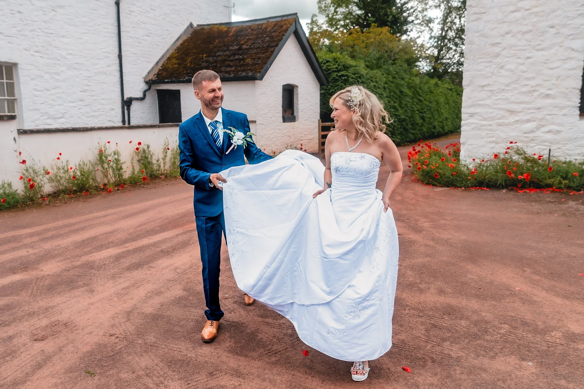 Bride and groom walking together at Barn at Brynich