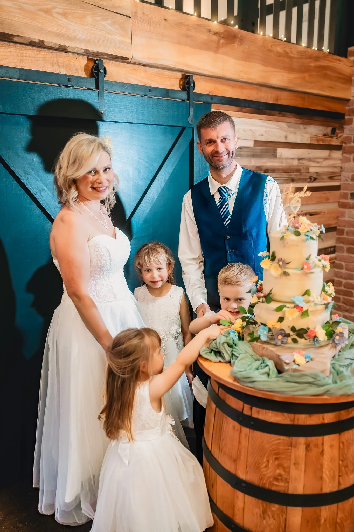 Bride and groom cutting their wedding cake