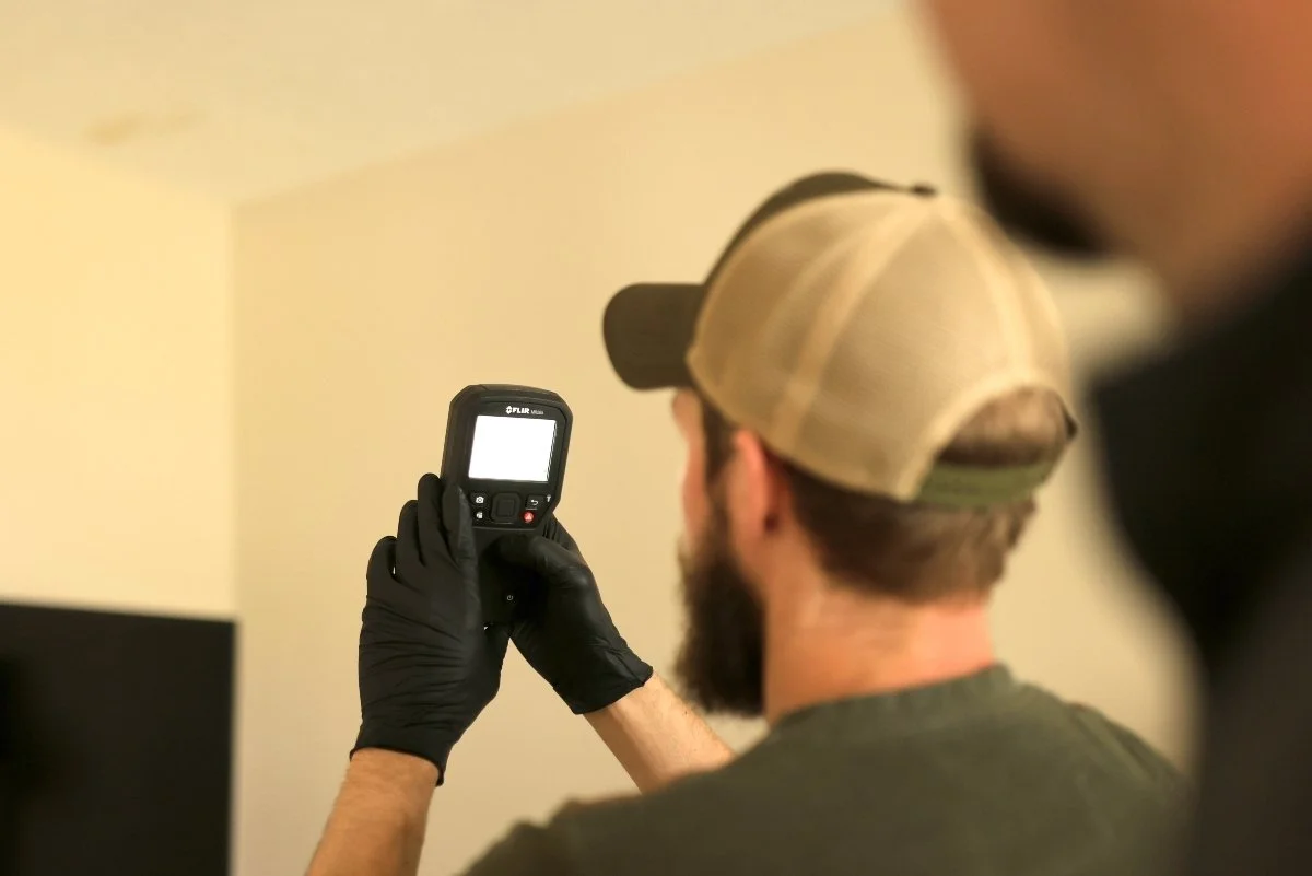 Moisture meter detecting hidden moisture in wall