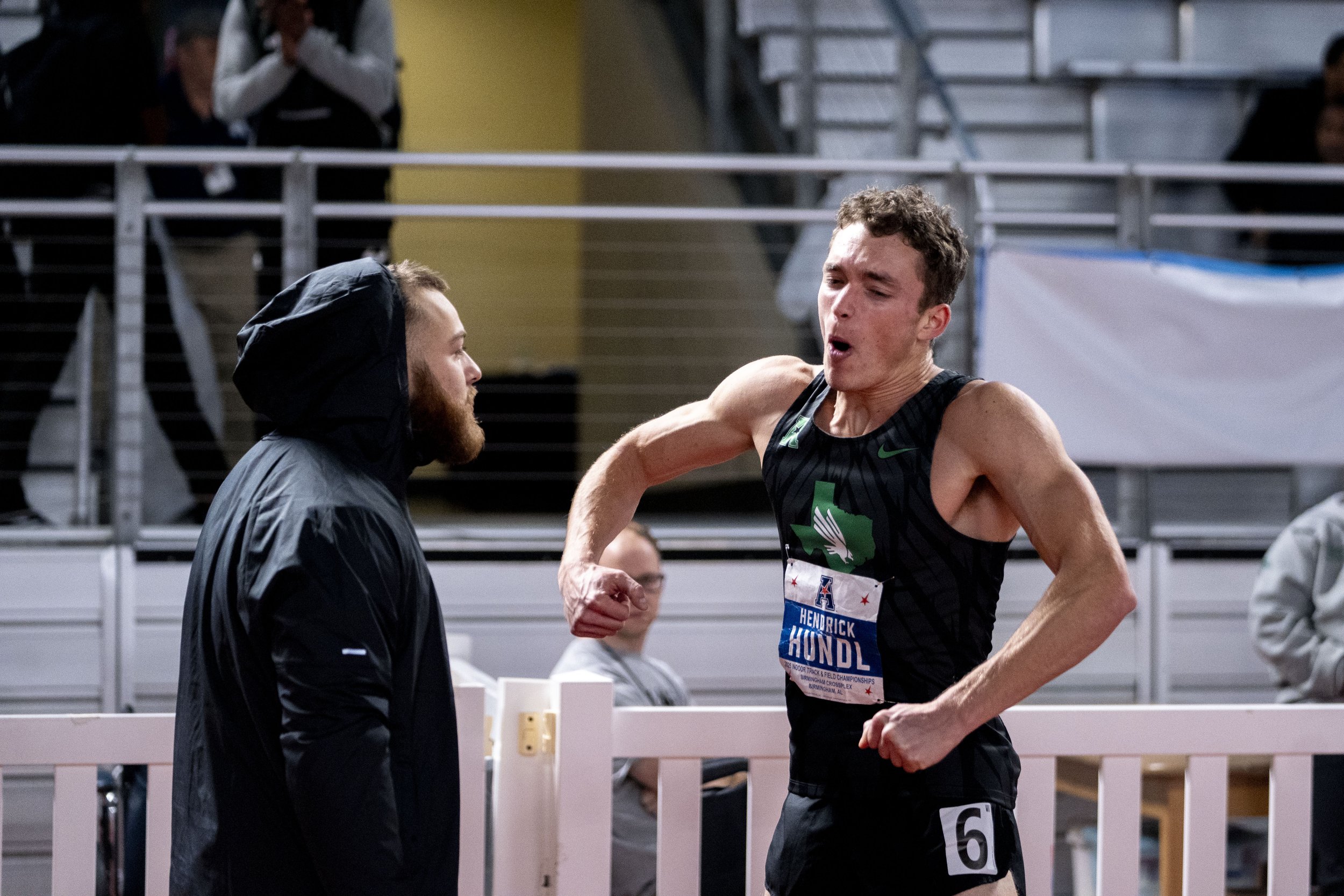 Hurdler Hendrick Hundle celebrates with a teammate after finishing 2nd in the 100-meter hurdles in Birmingham, Alabama on Feb 26, 2025