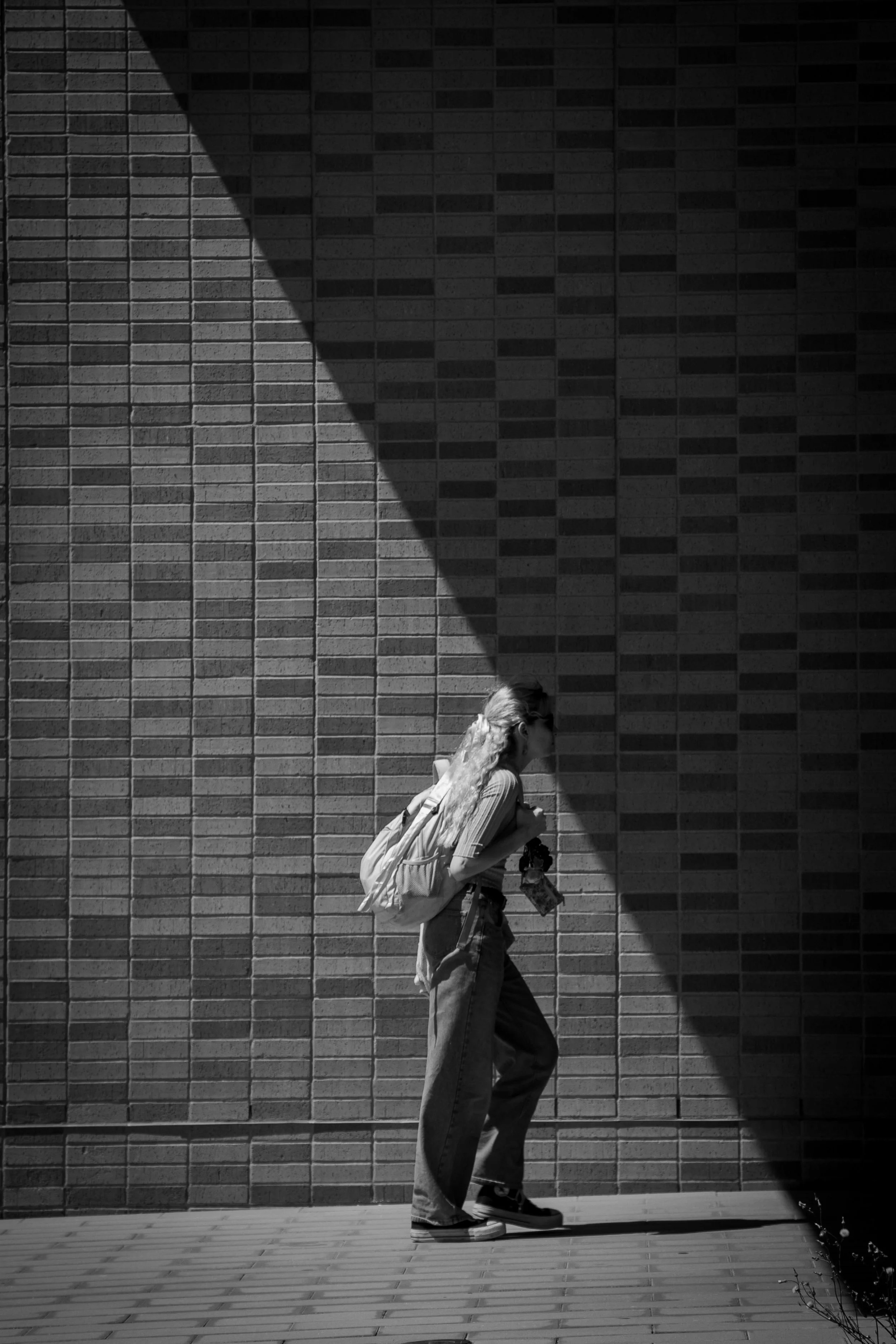 A woman walks in front of the art building on sept. 10, 2024