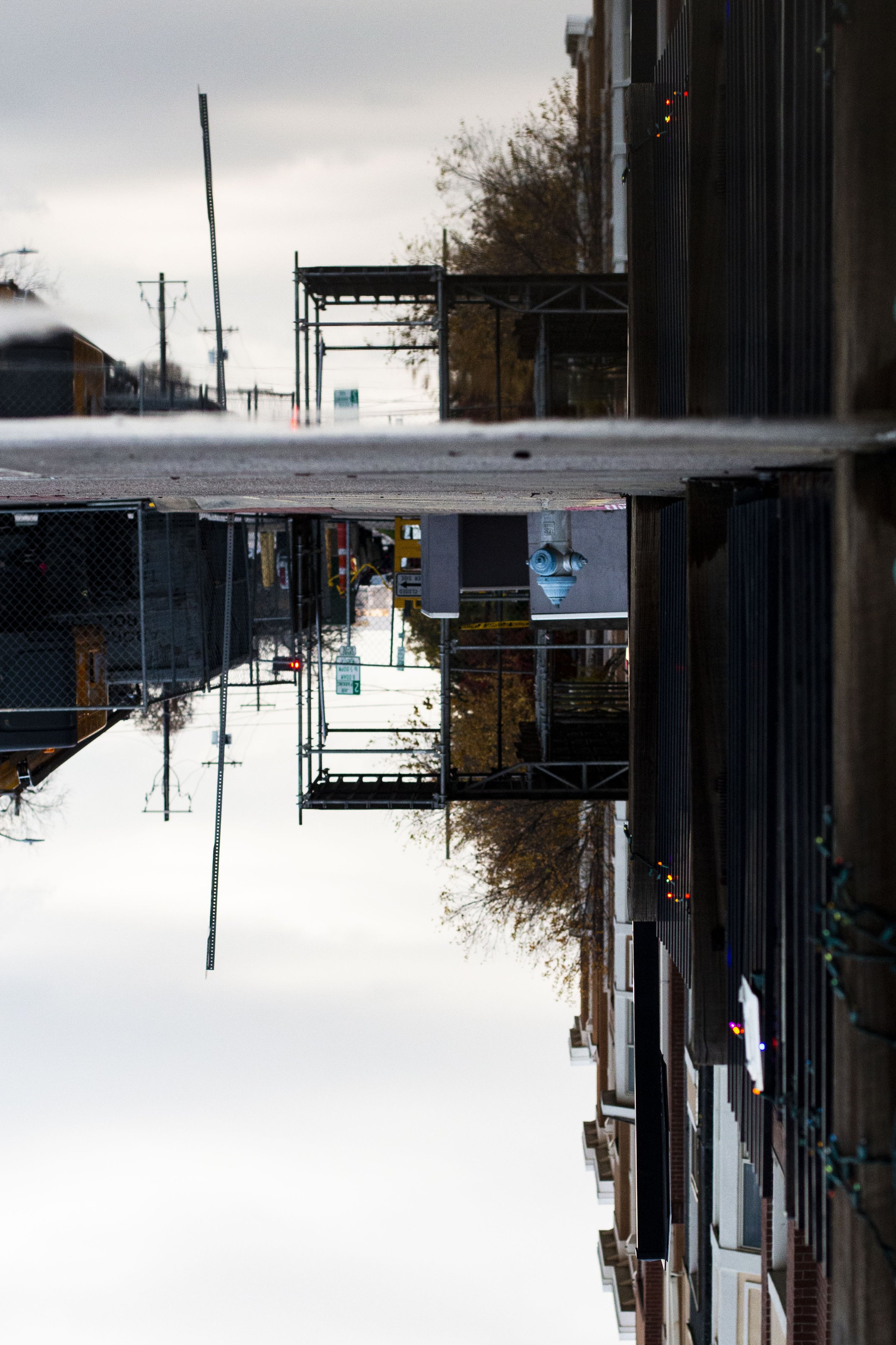 A puddle showing its reflection on Hickory street in Denton on Dec. 4, 2024