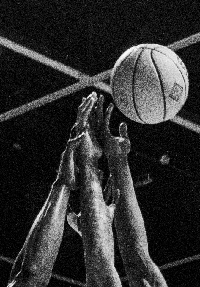 Hands reach for ball at the UNT vs Arkansas State game on March 23, 2025