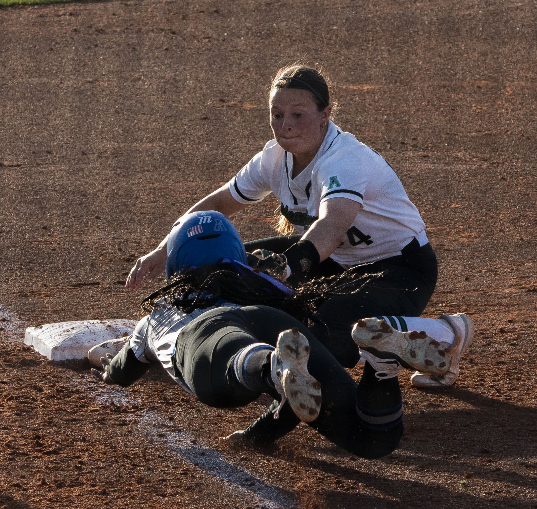 Third-baseman Tatum Sparks makes a tag to get the runner out in a game on March 22, 2025