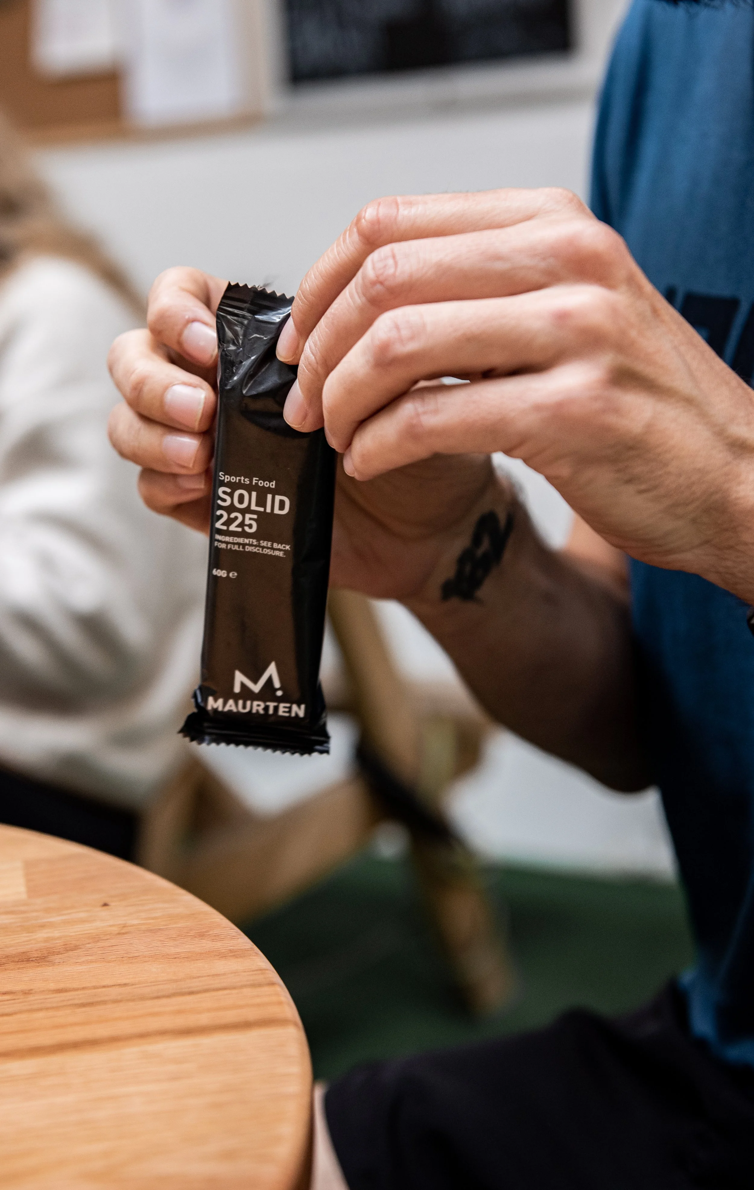 Person holding Maurten Solid 225 sports food bar
