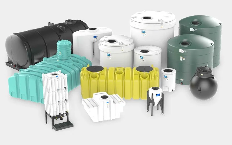 Various sizes and colors of water tanks and water storage containers produced by rotational molding, including black, white, green, blue, yellow, and gray models displayed on a white background.