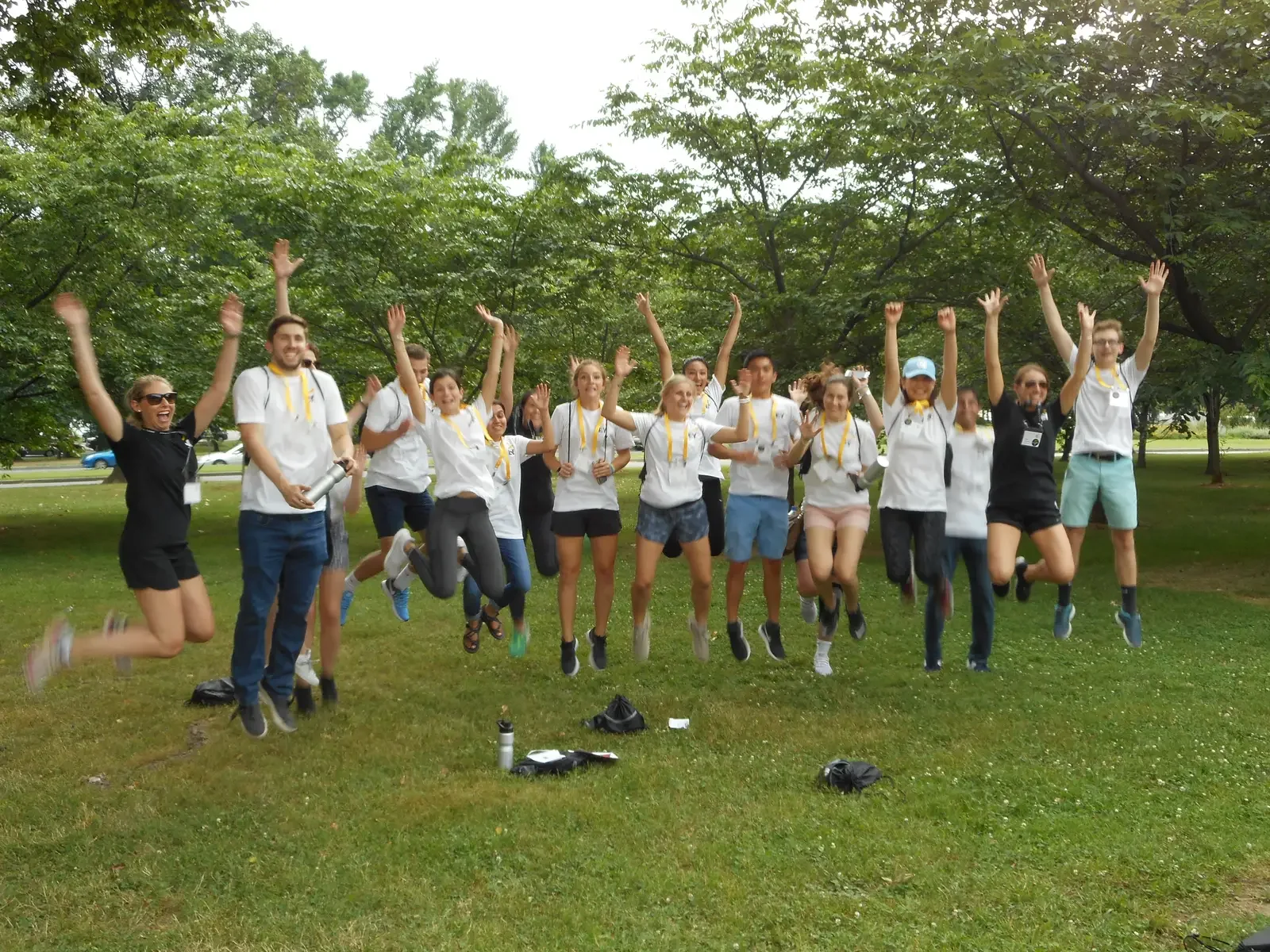 Corporate team celebrating outdoors during a scavenger hunt venue event