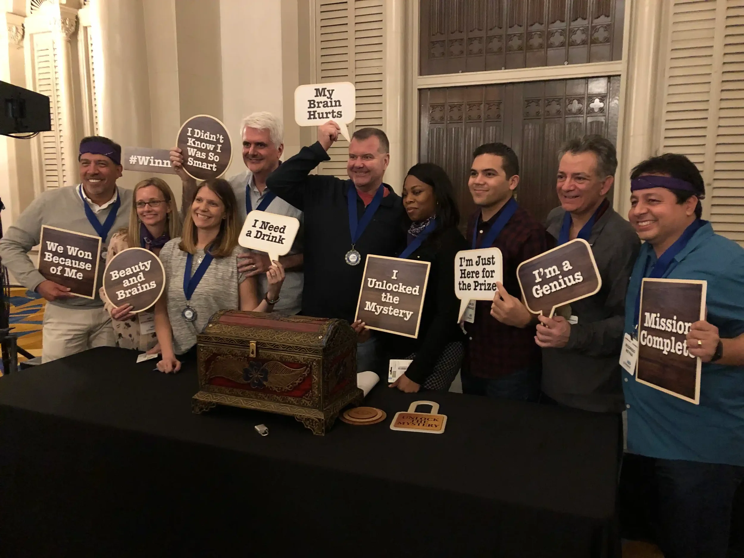 Event attendees solving escape room clues together at a corporate conference