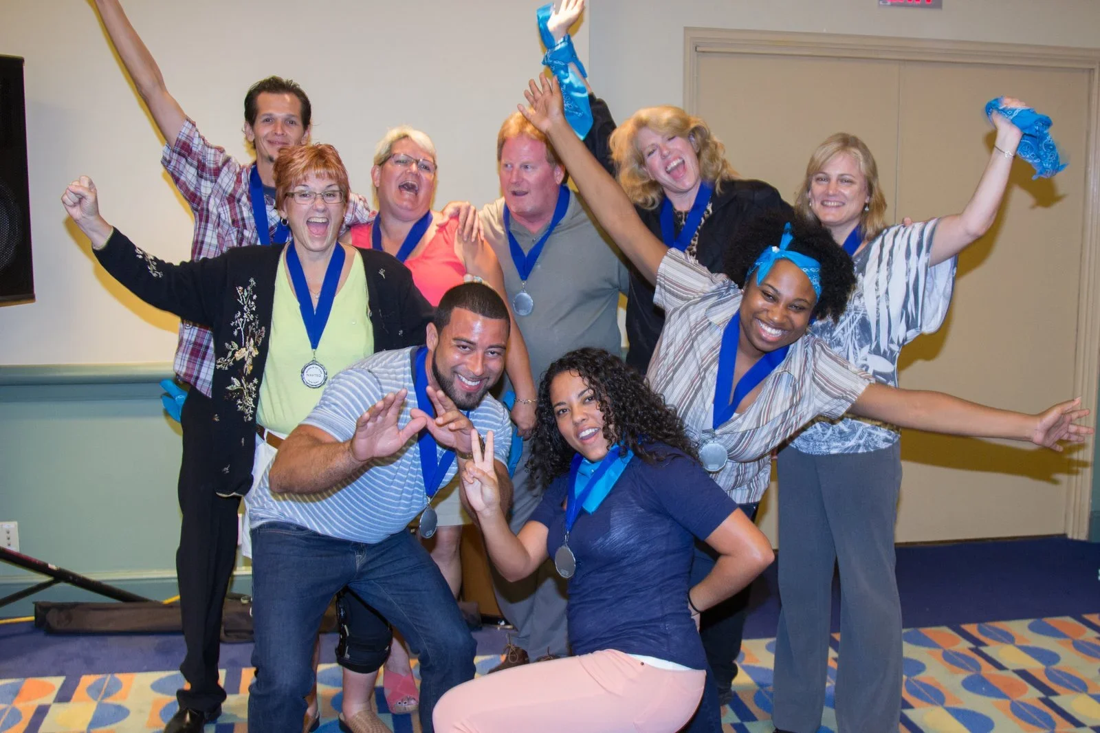Corporate scavenger hunt winners celebrating with medals