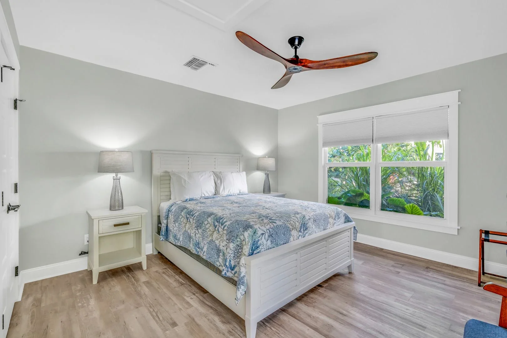 Bedroom with white bedding and private bathroom
