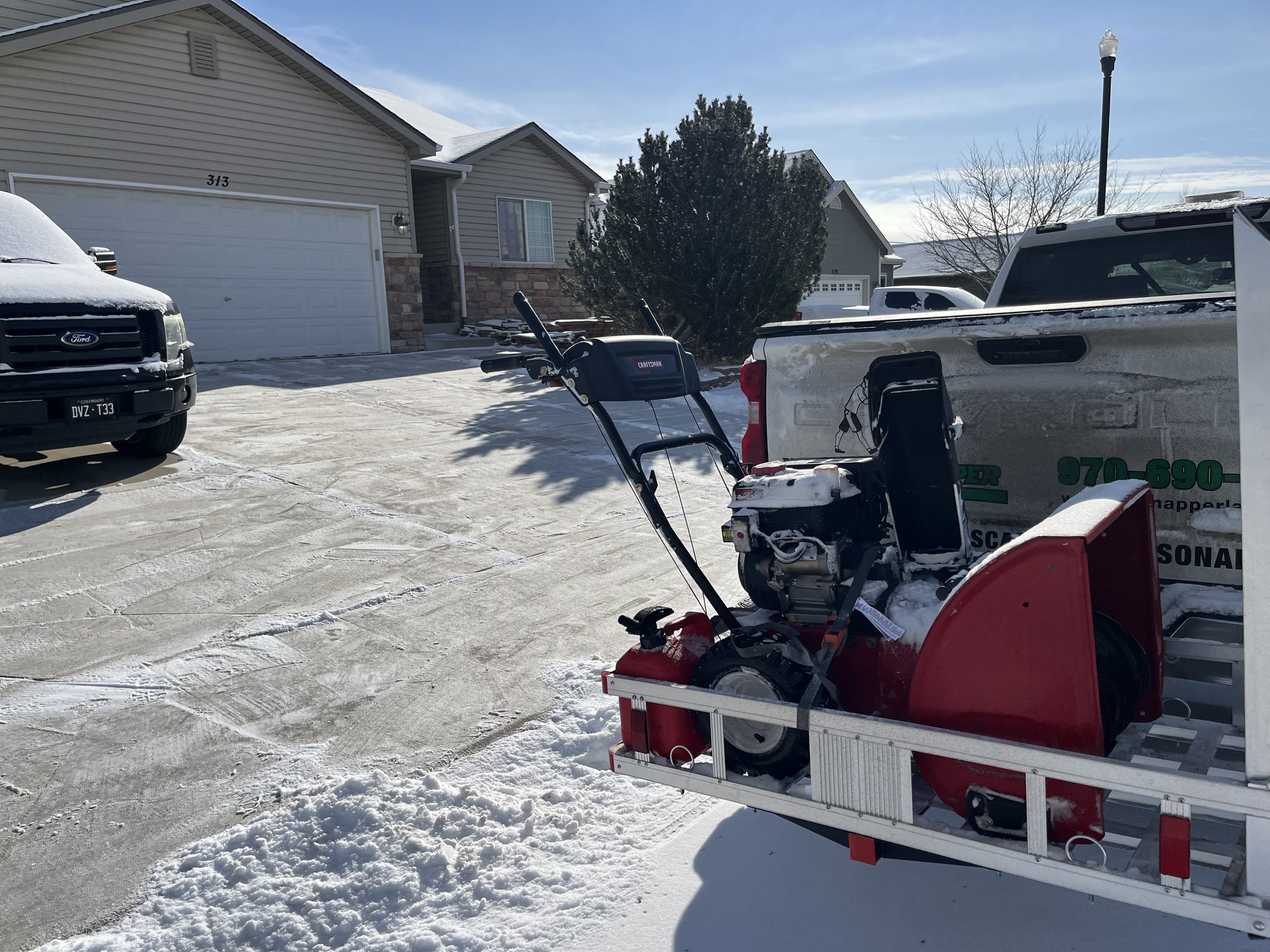 Whipper Snapper Lawn Care snow removal truck and snow blower equipment ready for residential driveway clearing services
