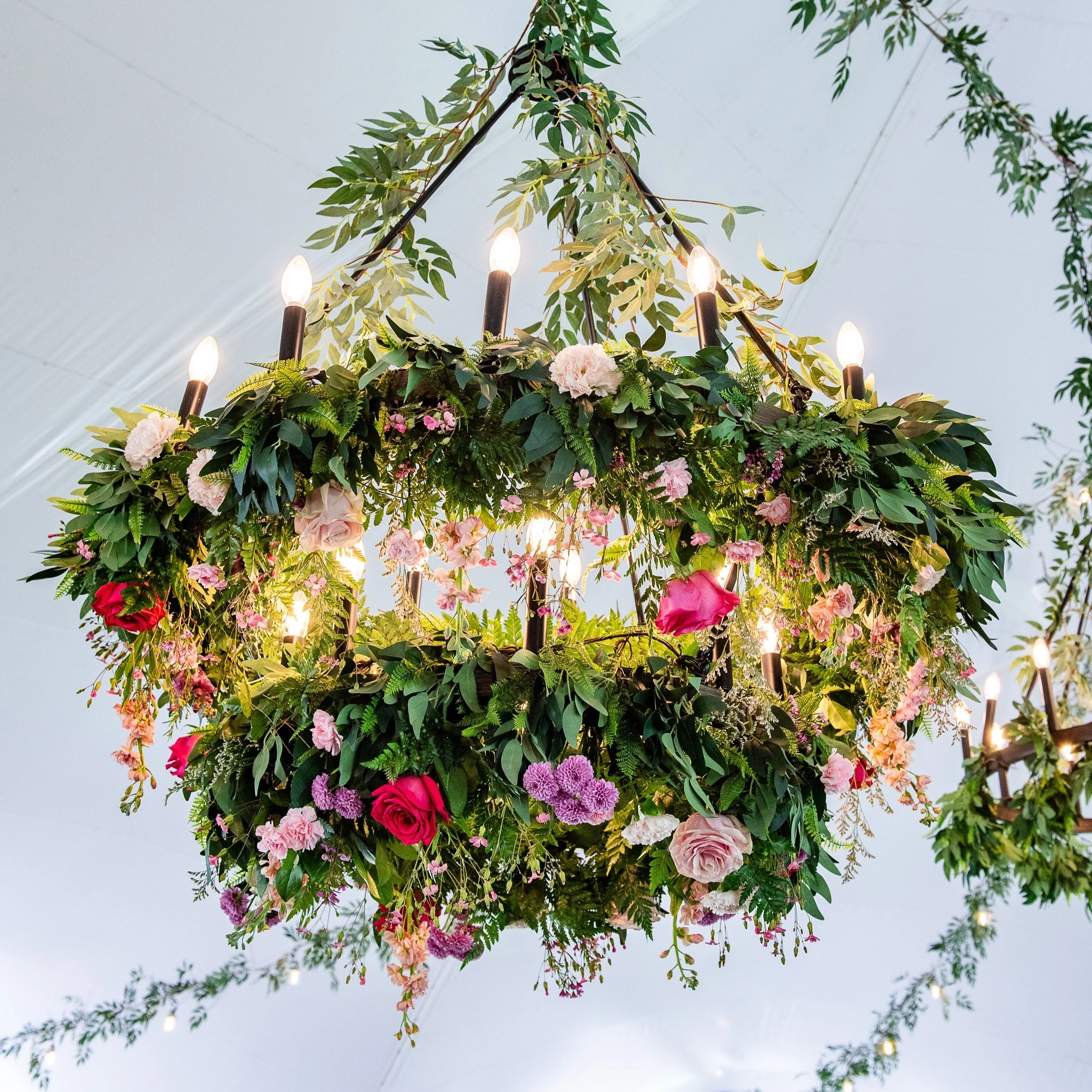 Floral chandelier with hanging greenery and flowers