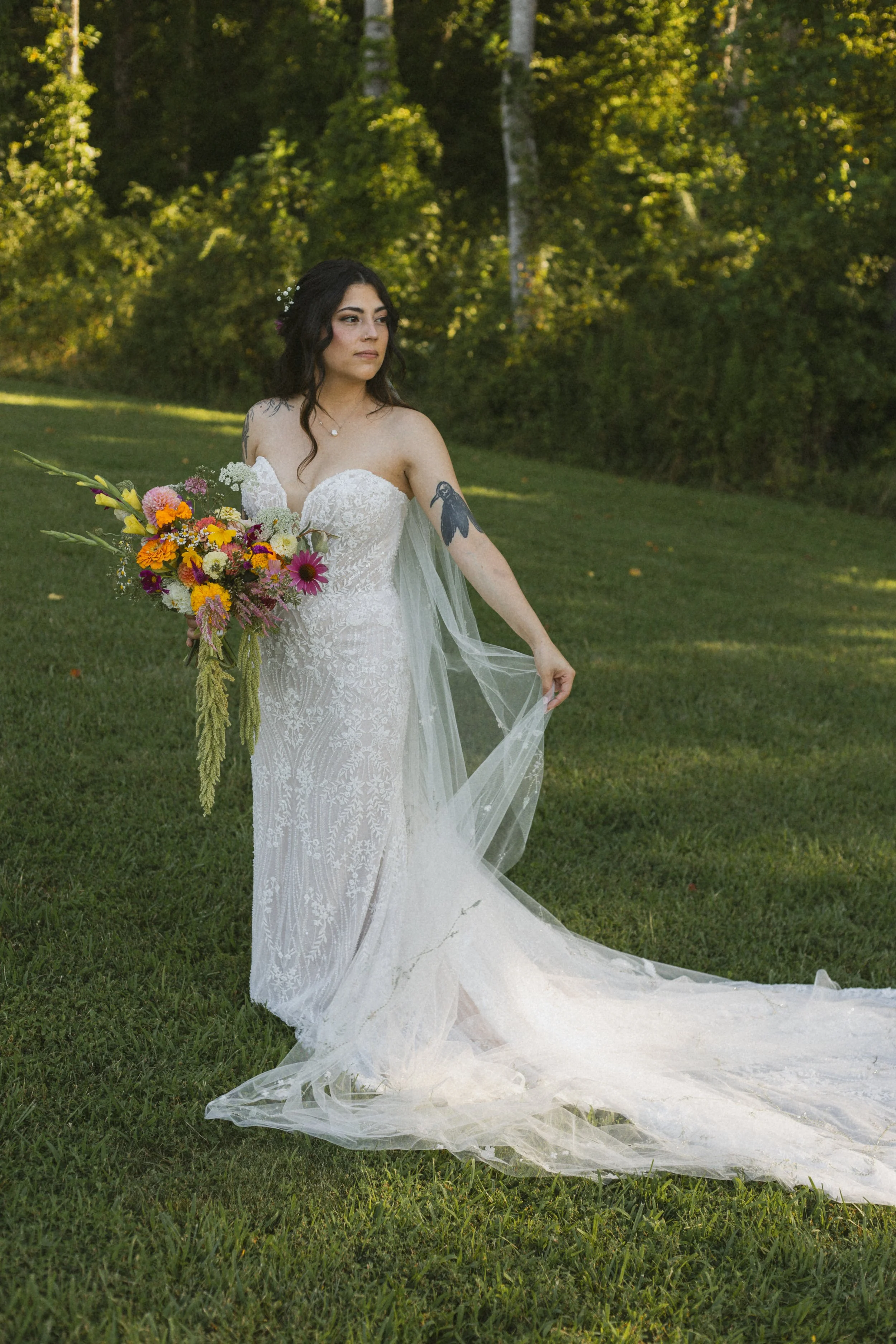 bride with her wildflower bridal bouquet featuring locally sourced blooms