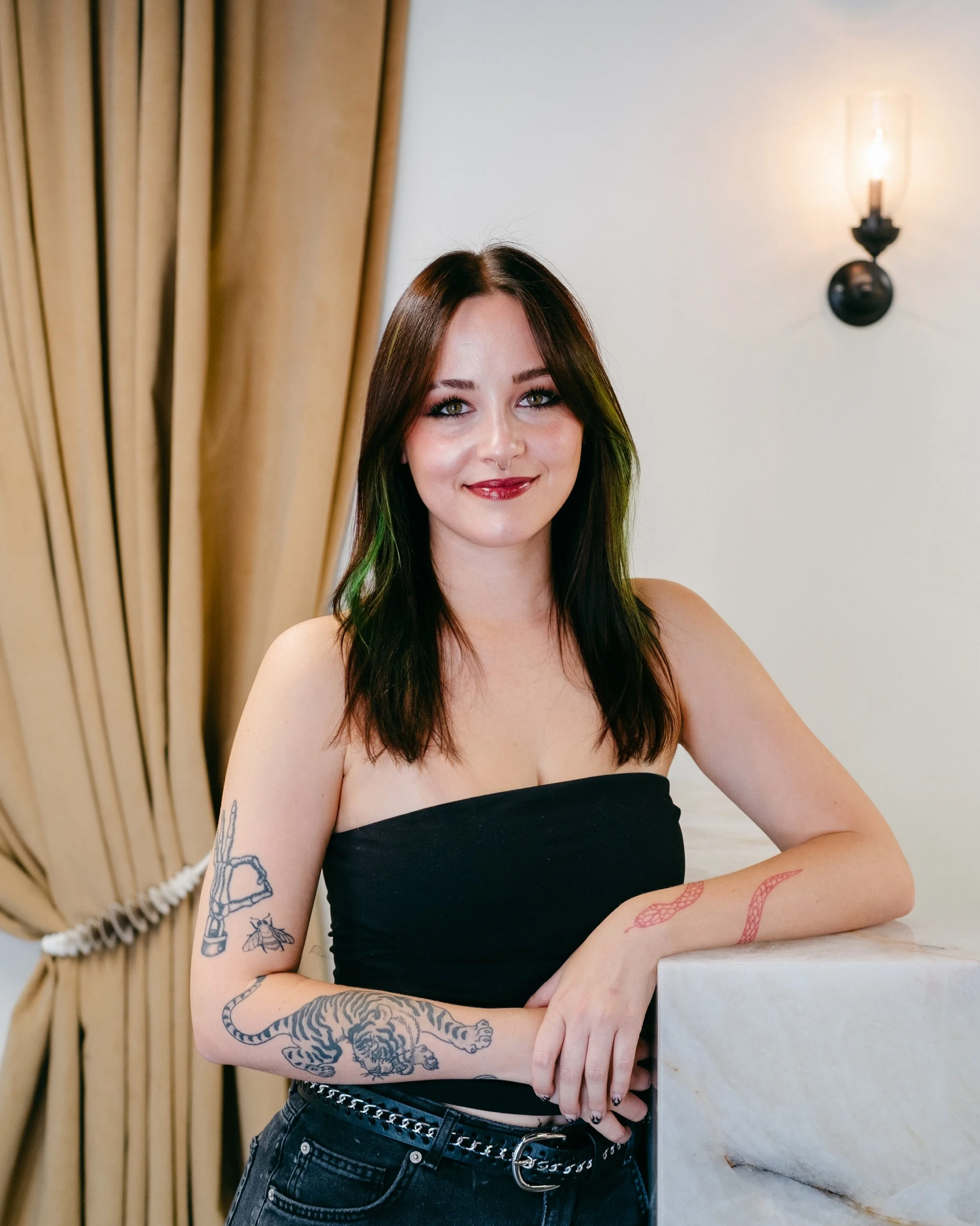 Britney Johnson, blonding specialist and K-Tip hair extension stylist at Opal Salon in Tuscaloosa offering dimensional blonde, balayage, lived-in blonde, and custom hair color.