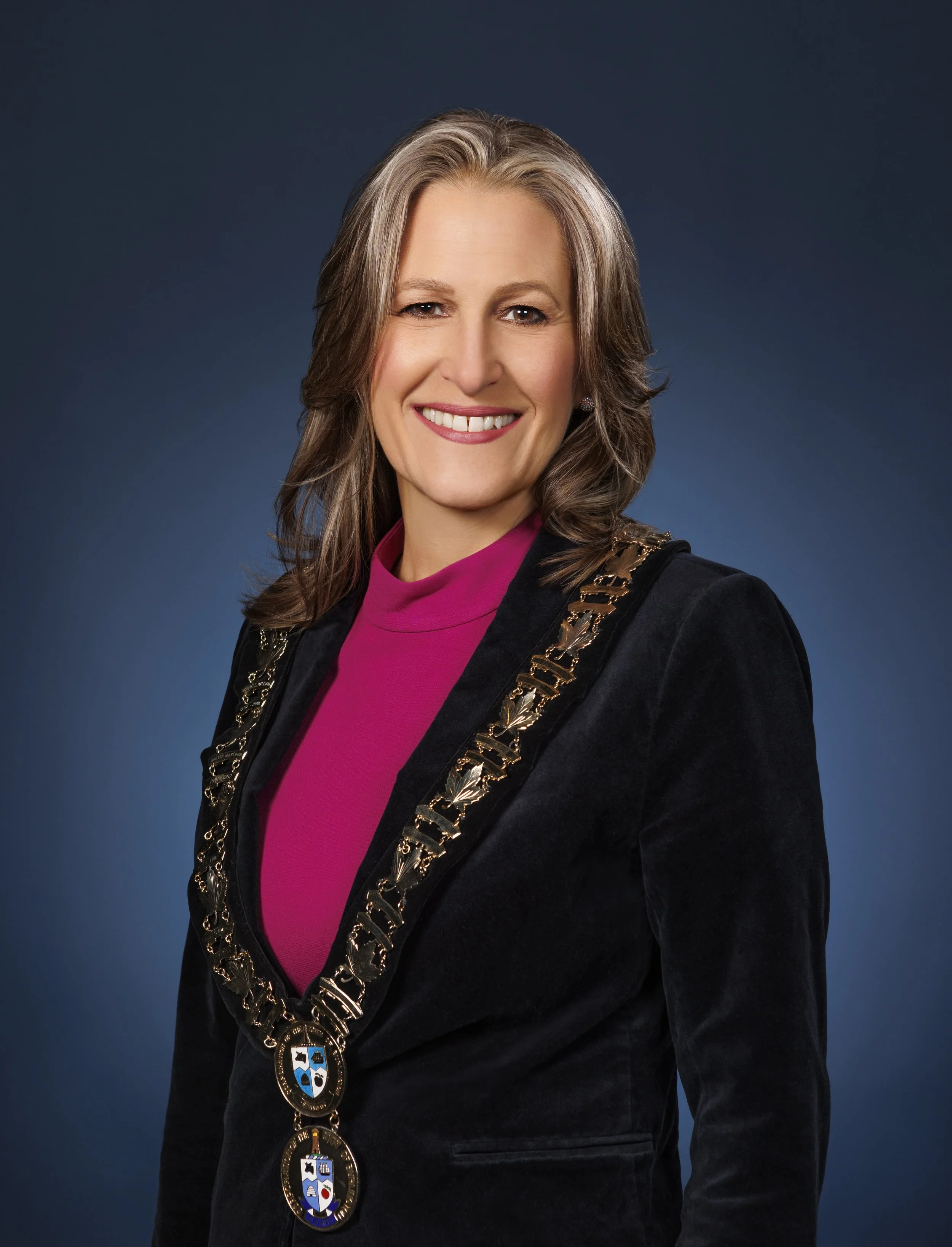 Official portrait of Burlington Mayor Marianne Meed Ward in a black velvet blazer wearing the Chains of Office.