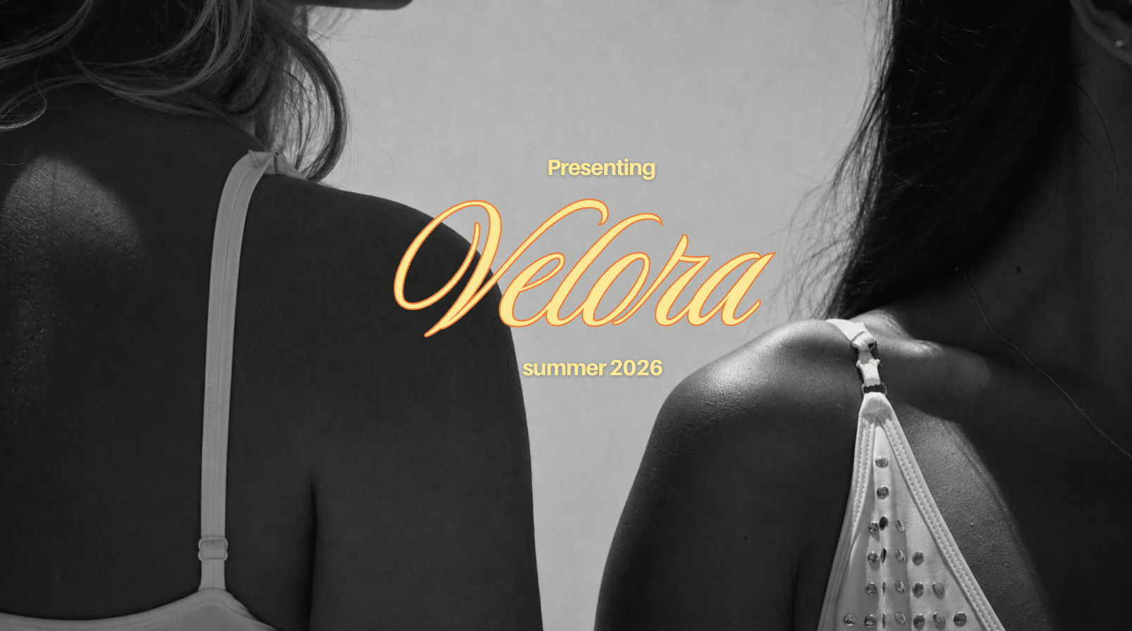 Black and white photo of two women showing their shoulders, one in a tank top with a ruffled strap and the other in a spaghetti strap top with metallic embellishments. Overlaid text reads: 'Presenting Velora summer 2026'.
